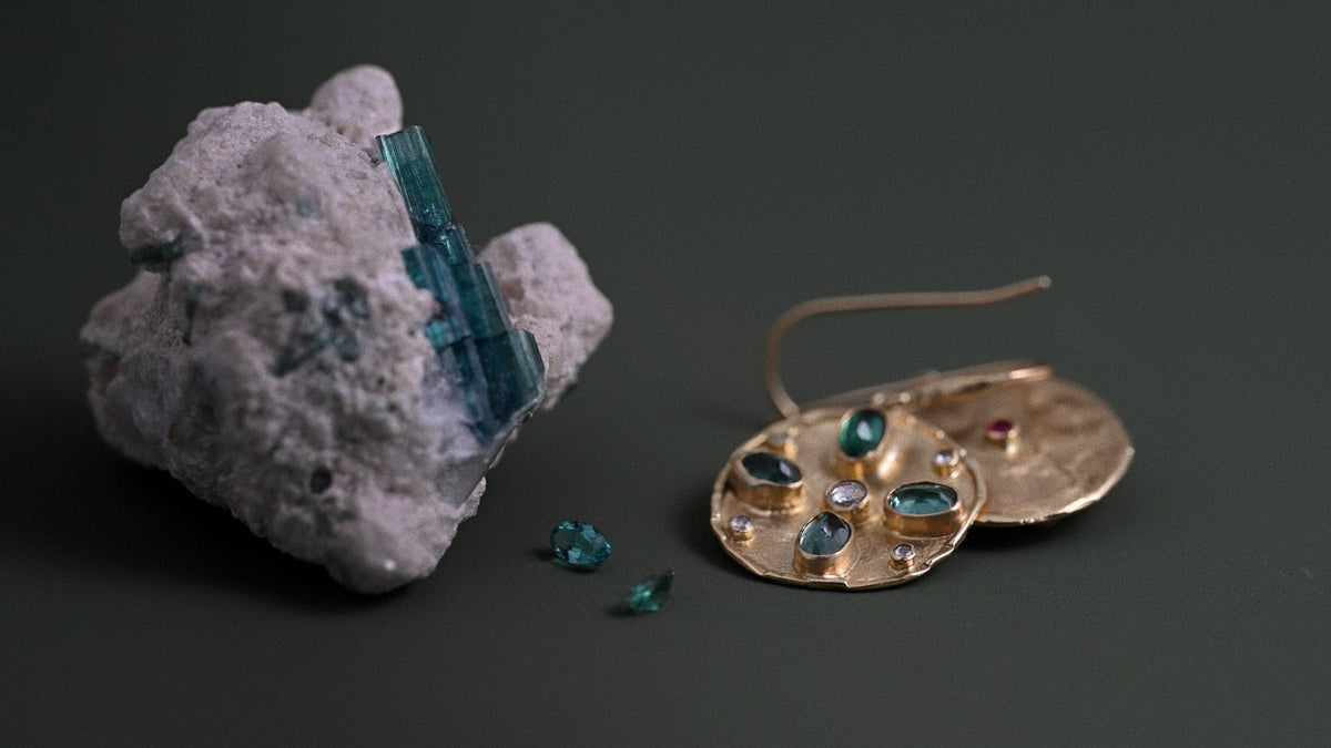 tourmaline crystal with florin tourmaline earrings and loose tourmaline crystals