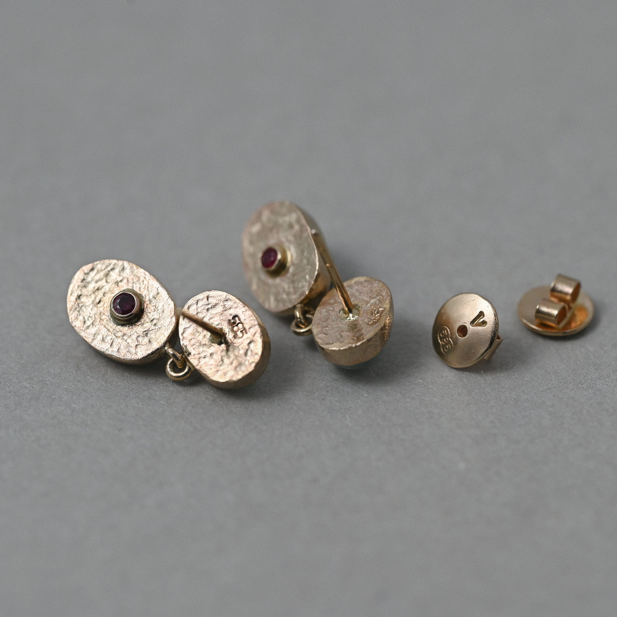 Vermilion Jewellery Duo Paraíba & Green Tourmaline 14ct gold earrings showing backs with hallmarks and ruby gemstone