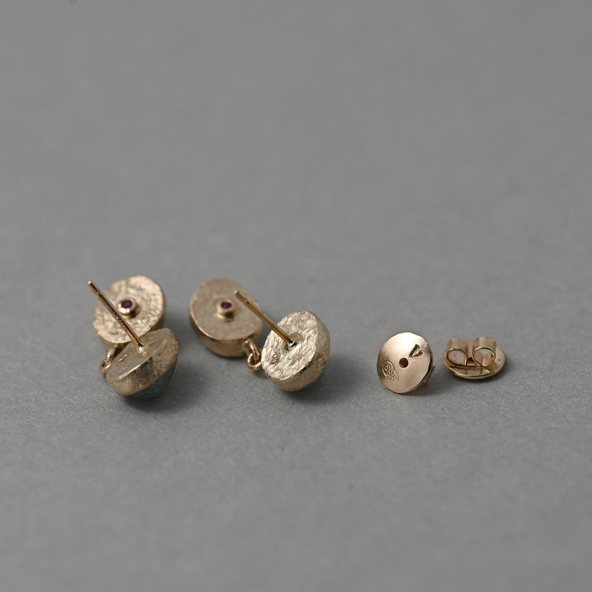 Backs of Duo Paraíba Tourmaline Stud Earrings in solid 14ct gold with vermilion signature ruby gemstone