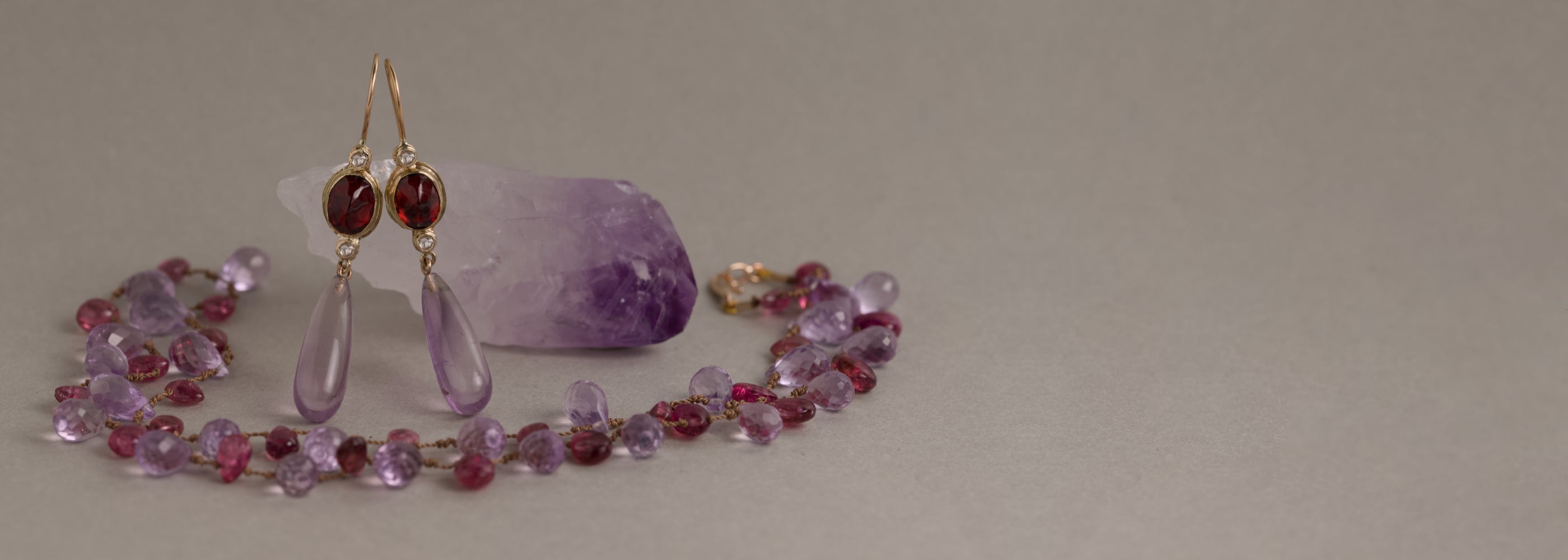 February amethyst jewellery collection featuring amethyst earrings and necklace in gold