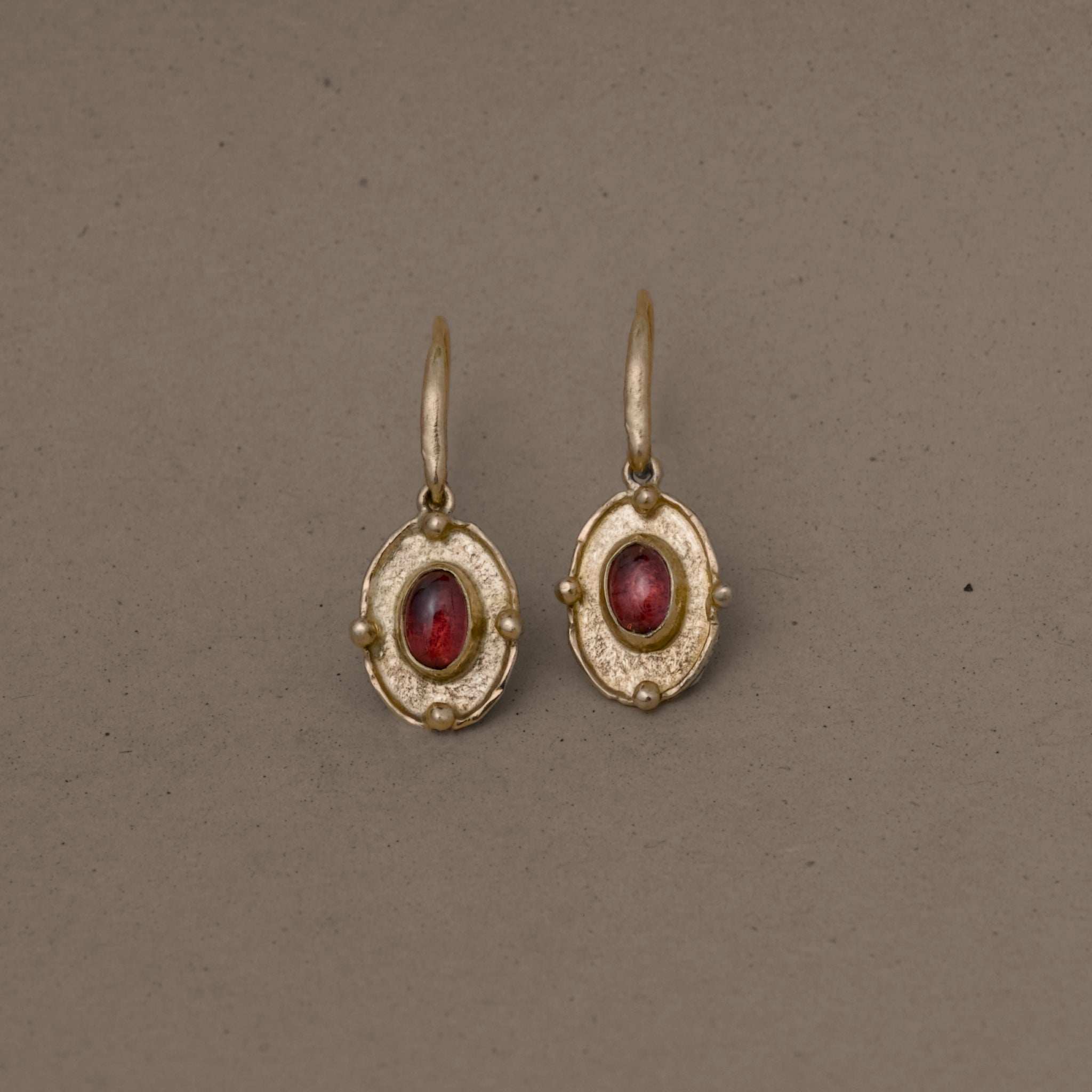 Florin Rhodolite Garnet Earrings with textured gold medallions and deep red garnet stones