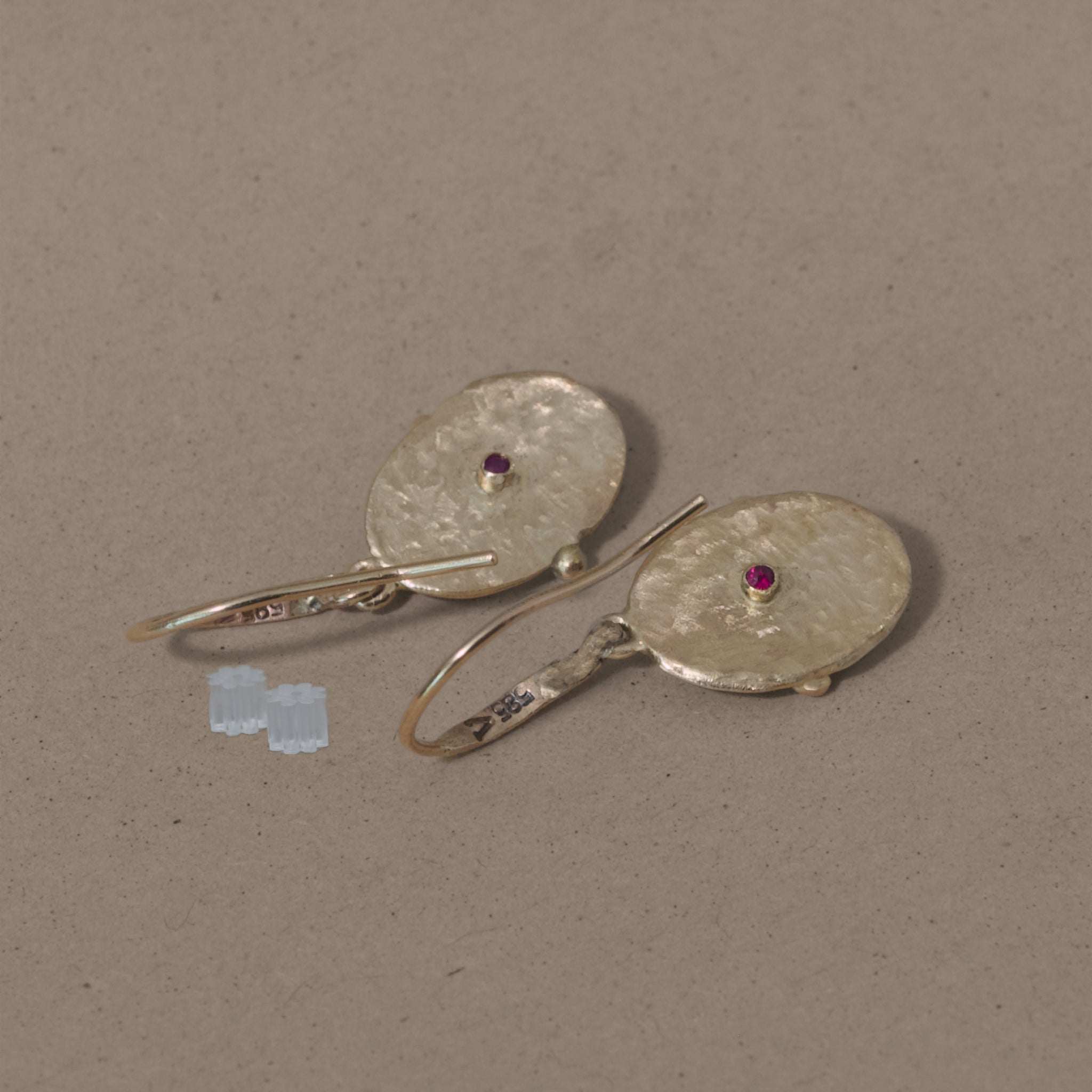 Florin Rhodolite Garnet Earrings with textured gold medallions and central rhodolite garnet stones