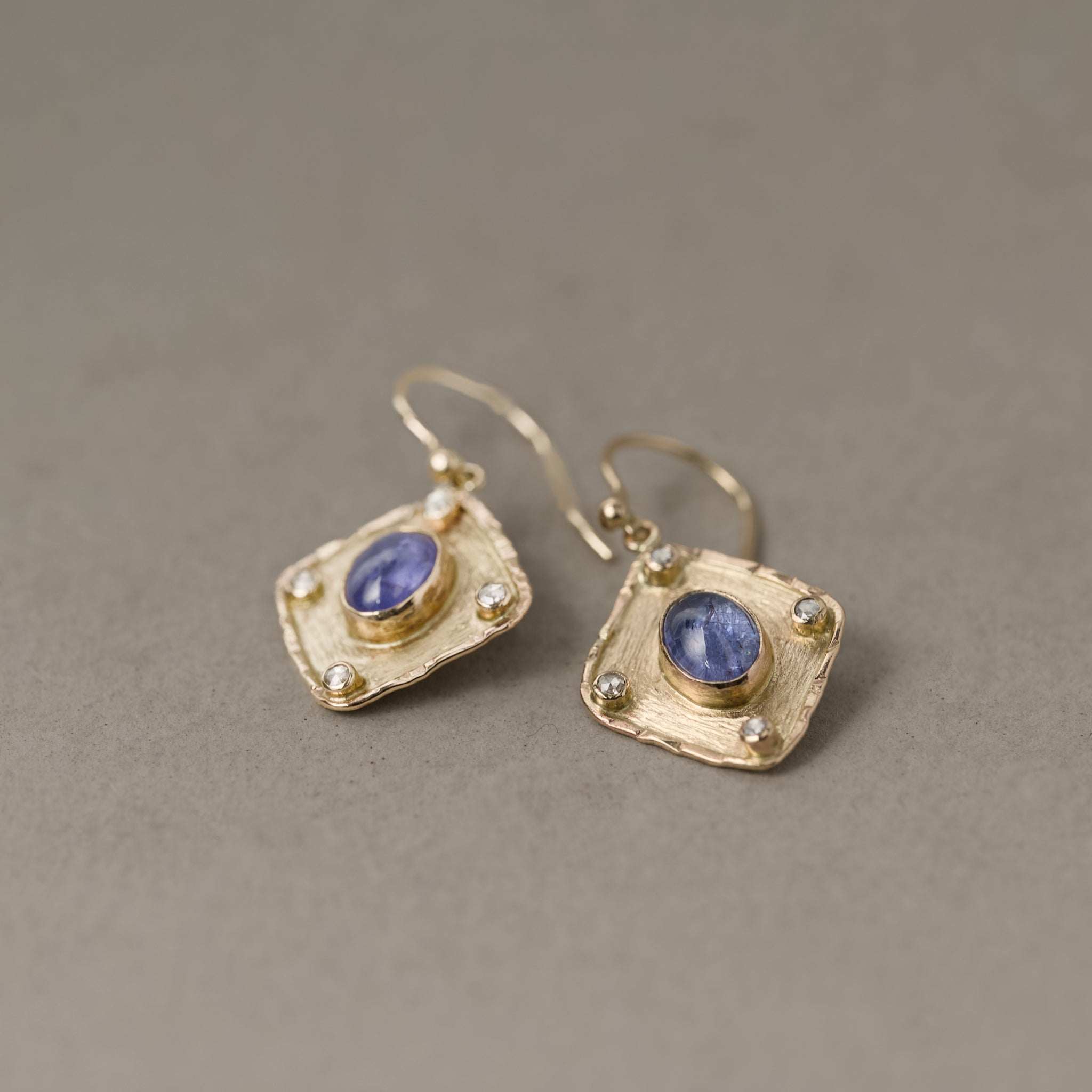 Florin tanzanite rose cut diamond earrings in gold with violet hues and sparkling diamonds