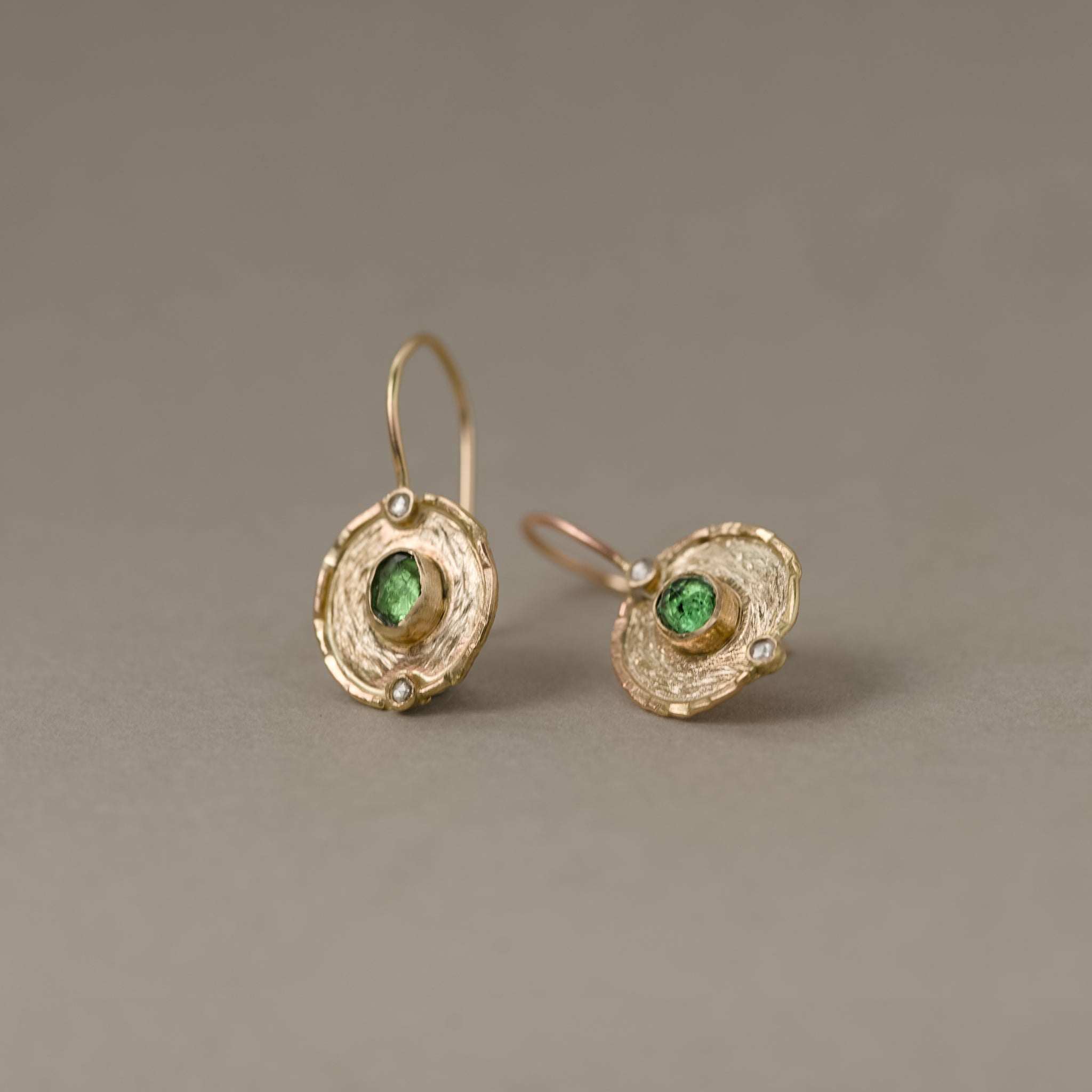 Florin Tsavorite Diamond Earrings with verdant tsavorite and rose diamonds in textured gold medallions