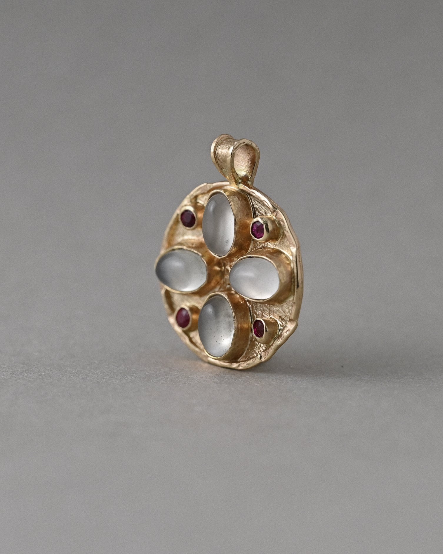 Moonstone Florin medallion necklace in 14ct solid gold with white moonstones and Mozambique rubies