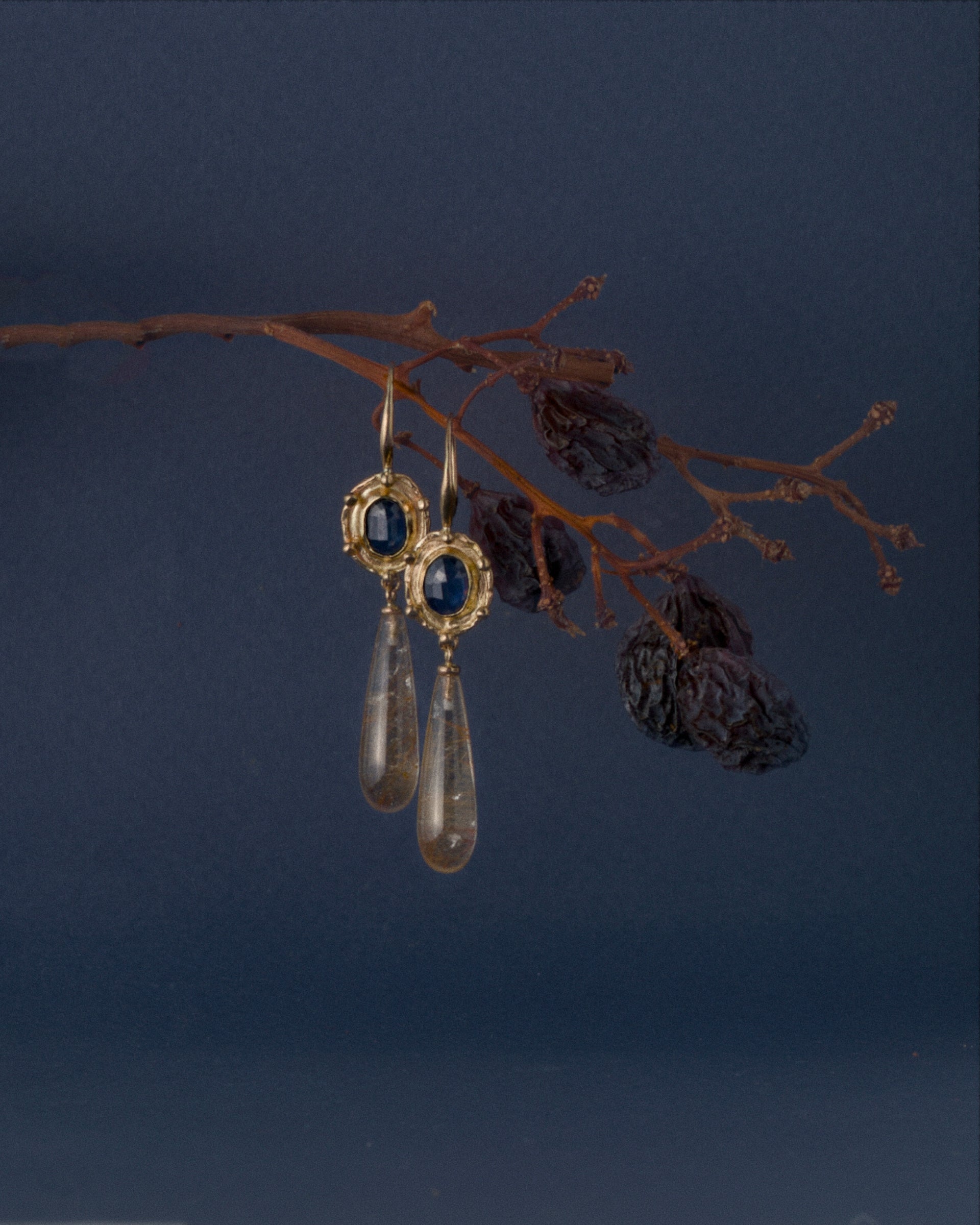 Florin sapphire and gold rutilated quartz hanging from grape