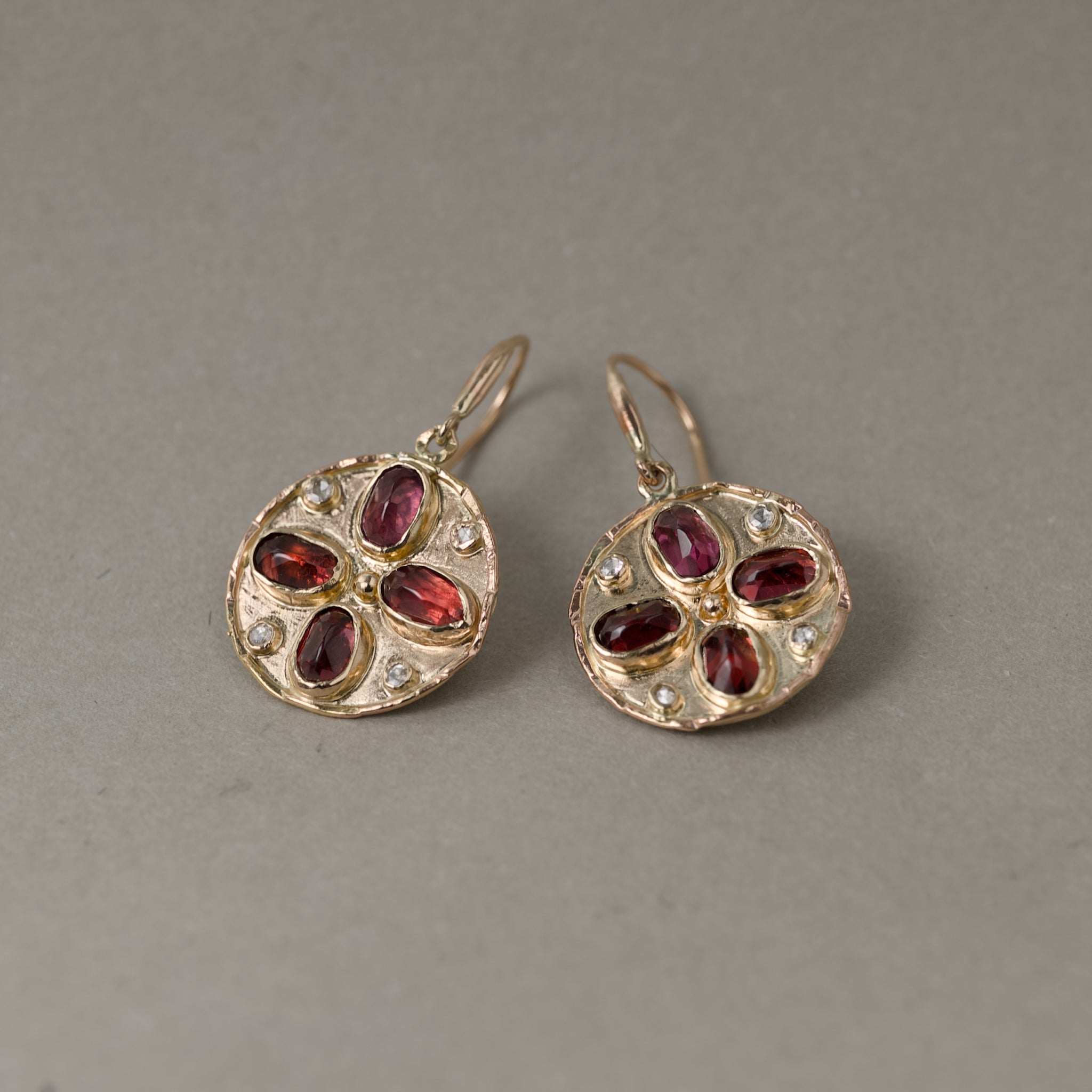 Florin Alta Malaia Garnet Earrings with gold and diamond accents showcasing rich crimson garnets