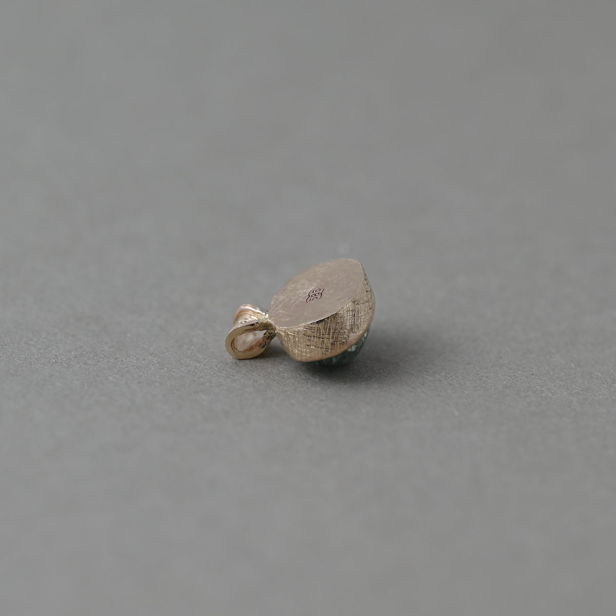 Vermilion Jewellery Uno pendant featuring the back of Paraíba tourmaline set in 14ct solid gold.