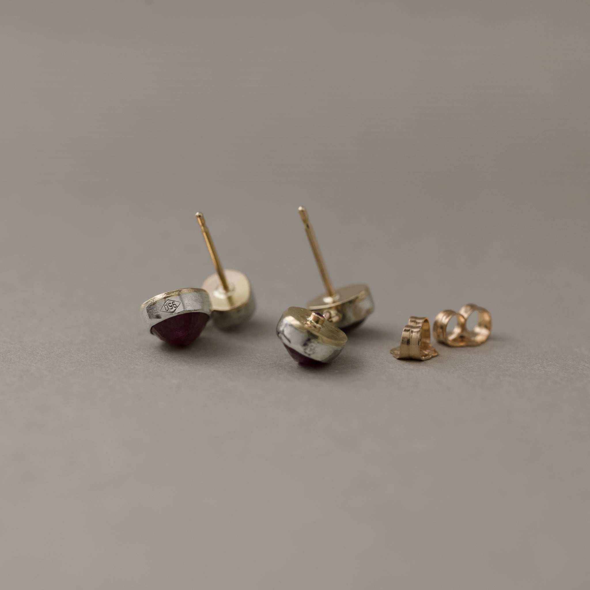 Duo Platinum Ruby Stud Earrings with gold, platinum, rubies, and spinels in elegant design