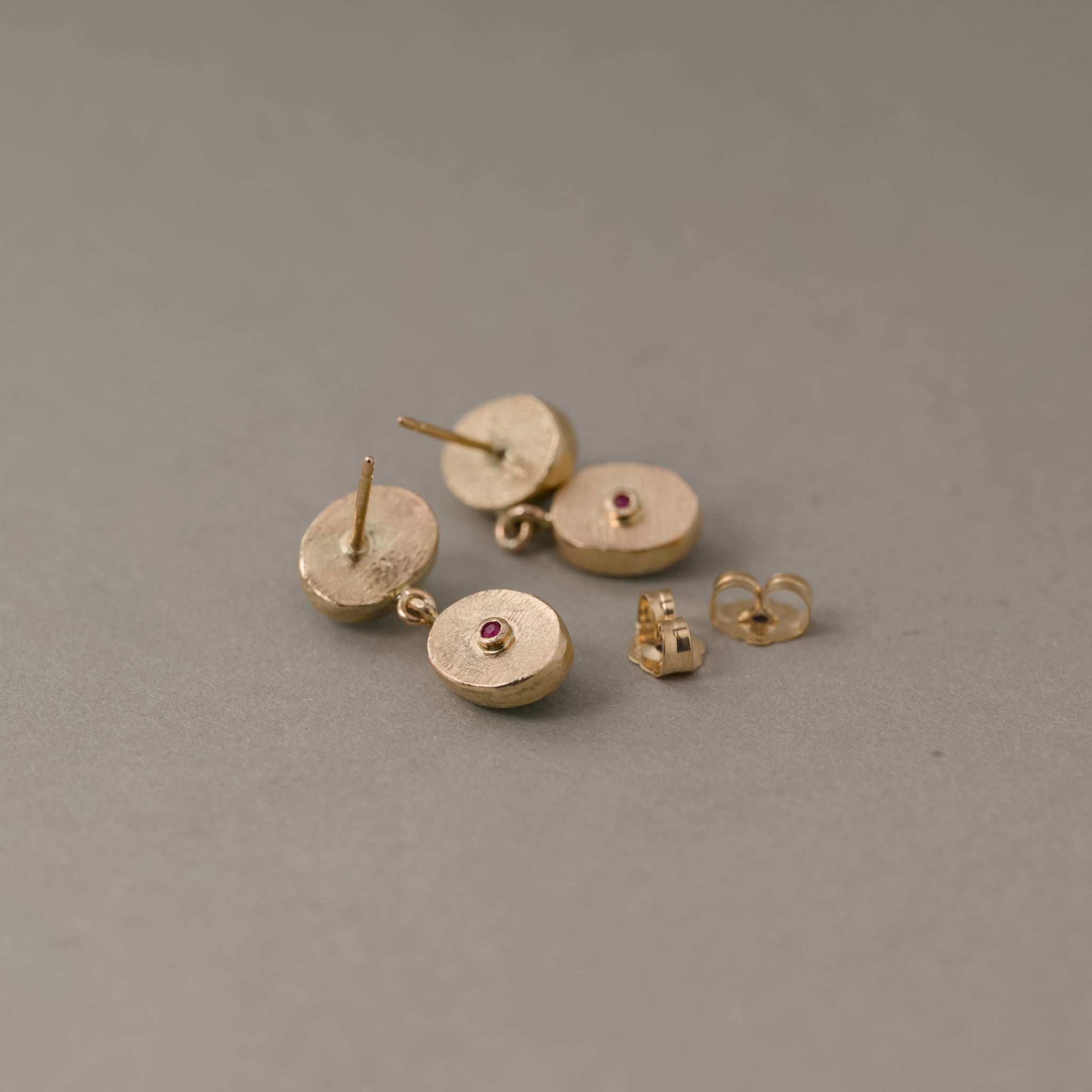 Duo Paraíba tourmaline stud earrings with aqua blue gemstones set in gold