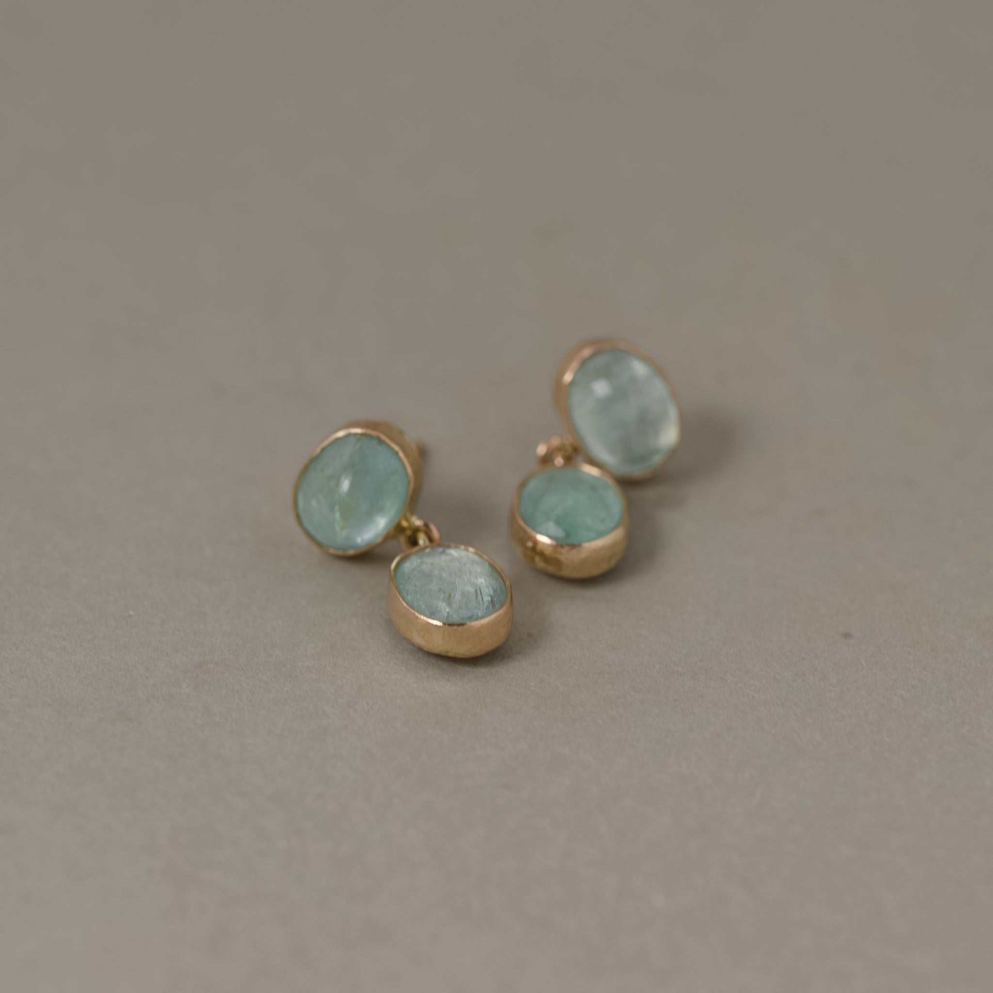 Duo Paraíba Tourmaline stud earrings with aqua blue stones set in gold