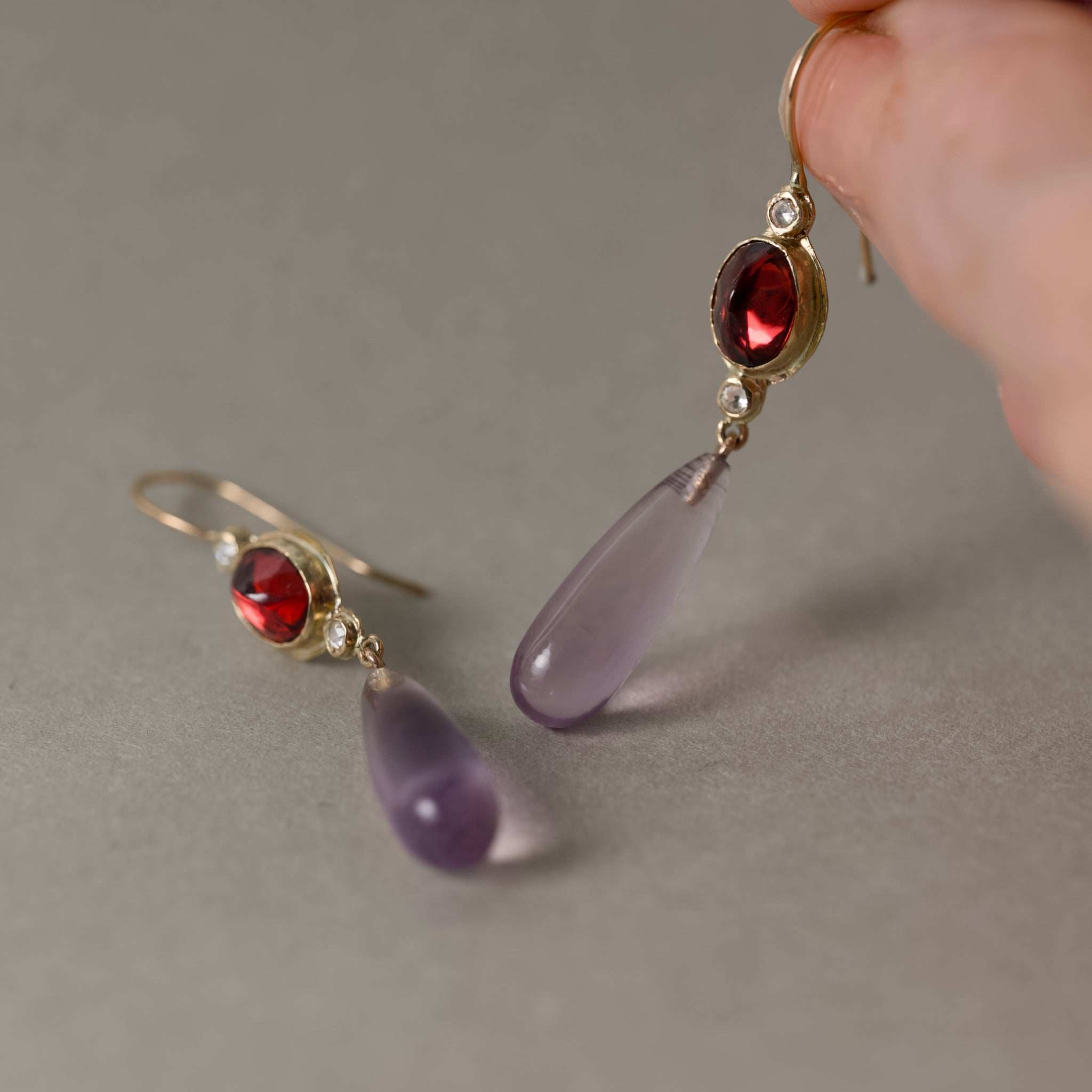 Sera Amethyst Garnet Earrings featuring lilac amethyst drops, wine garnets, rose-cut diamonds, and gold setting.