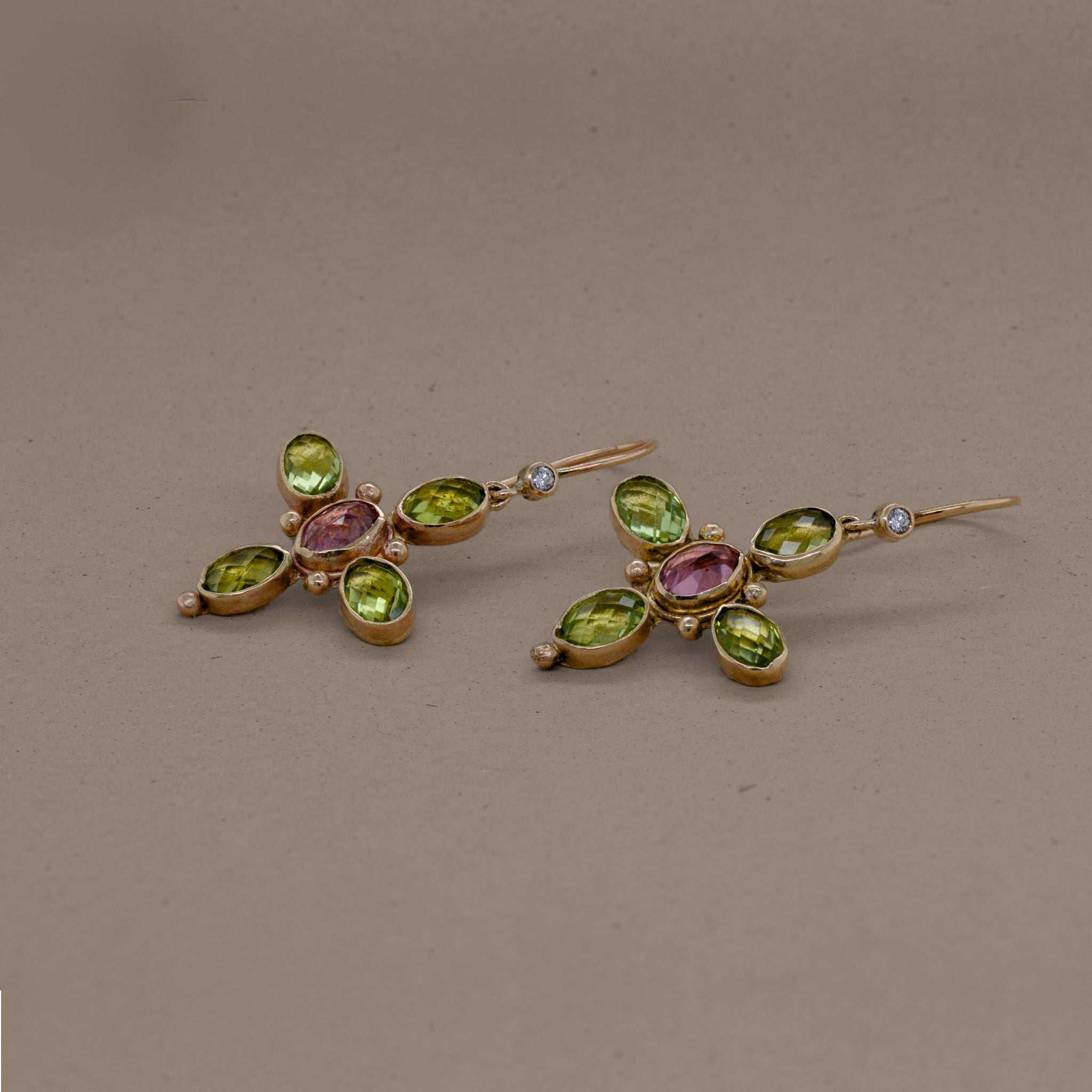 Gold Quattro earrings featuring green peridot, pink tourmaline, and diamond gemstones.