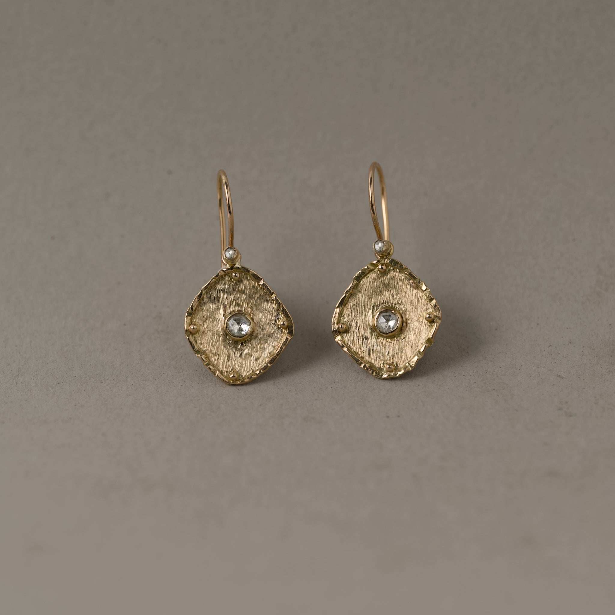 Florin rose cut diamond earrings with textured gold and intricate facets