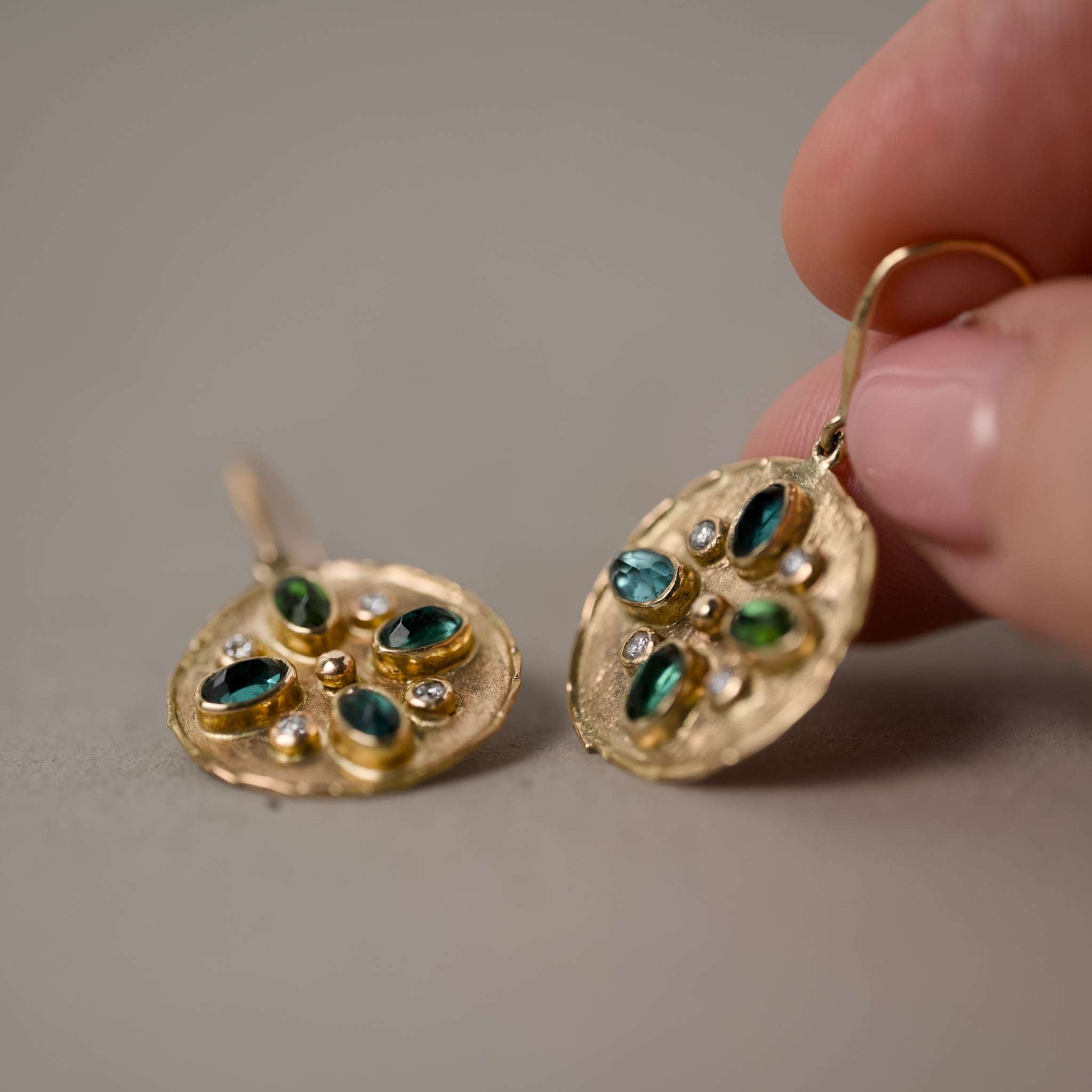 Handcrafted gold earrings with indicolite tourmalines and sparkling diamonds