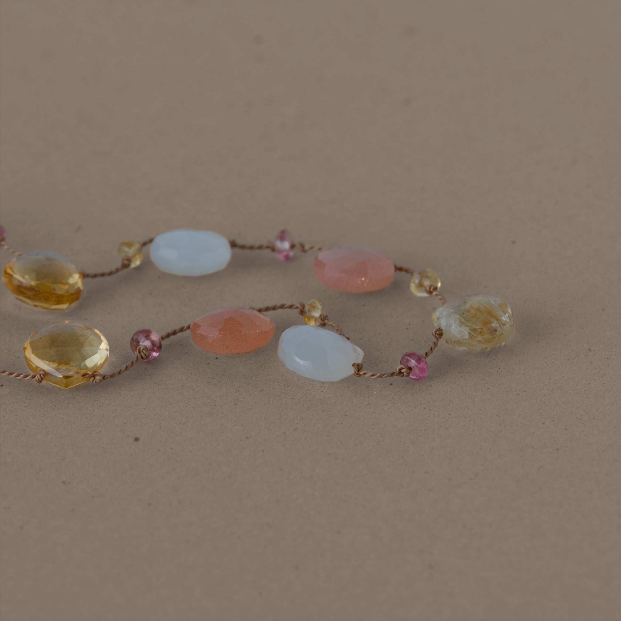 Lido Moonstone Citrine Gemstone Necklace with Gold Clasp and Ruby Adornment.