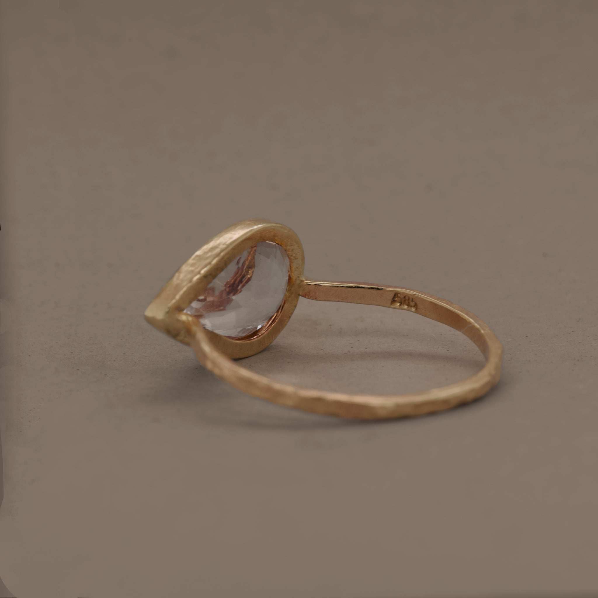 Handcrafted pear-shaped morganite ring in 14ct gold setting.