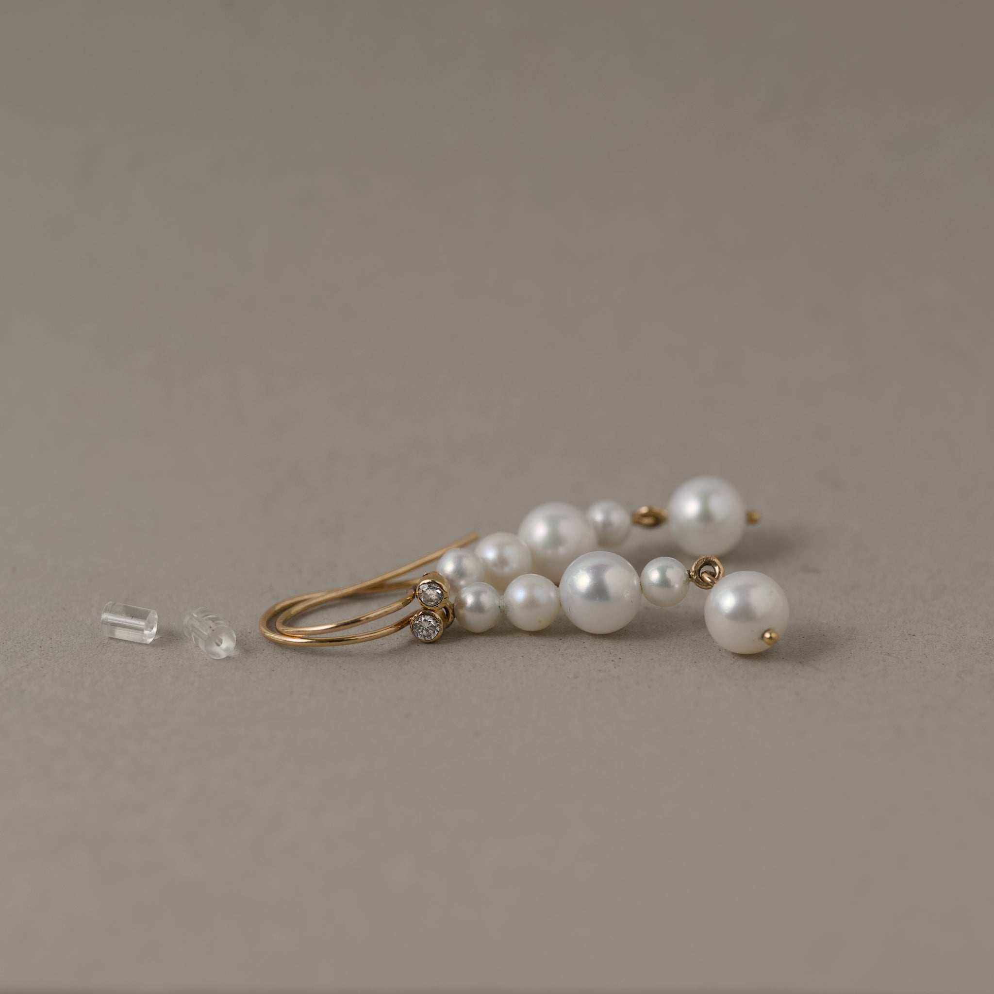 Ondina Freshwater Pearl diamond drop earrings in gold with glimmering diamonds and pearl details