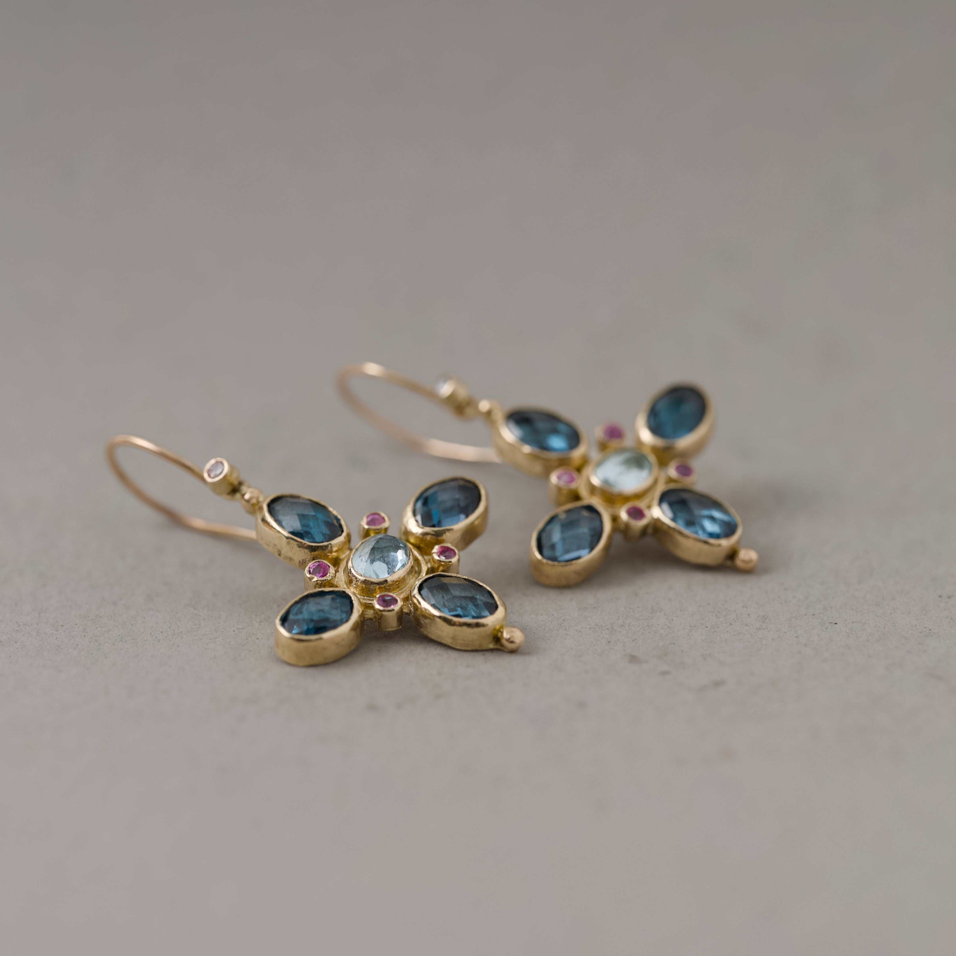 Gold Quattro Topaz Aquamarine Earrings with blue topaz, aquamarine, and pink sapphire gemstones