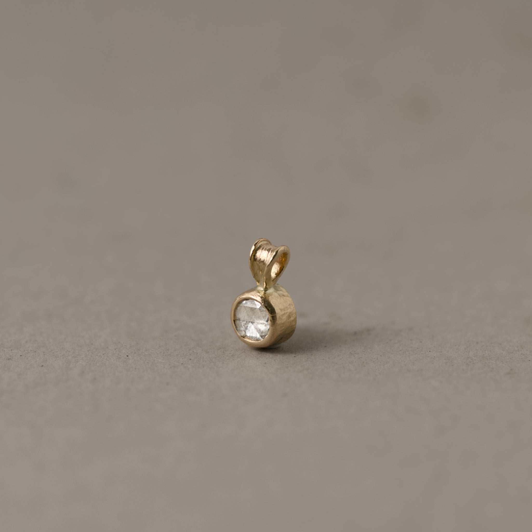Rose cut diamond pendant necklace in gold with soft glowing facets and refined design