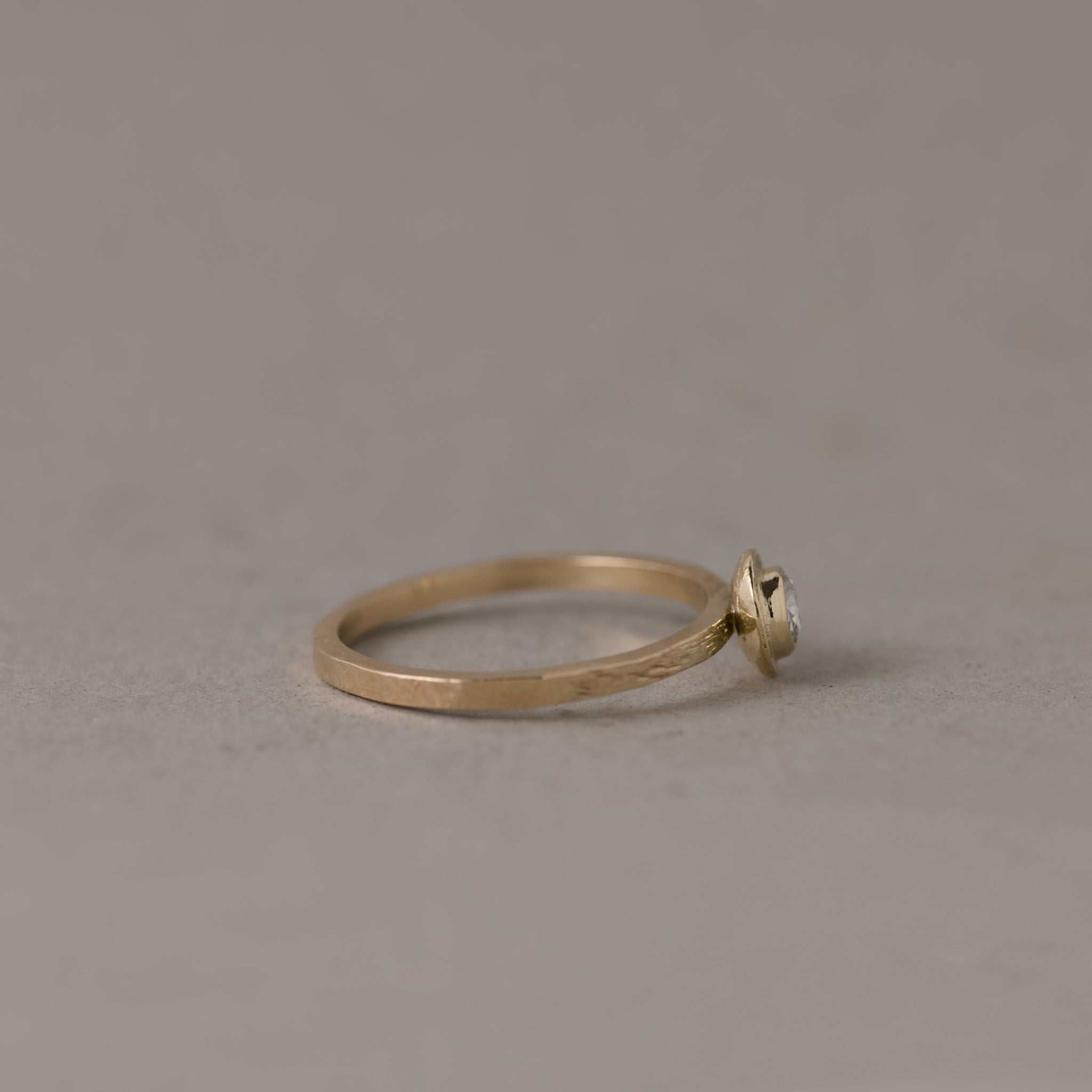 Soletta Rose Cut Diamond Ring in textured gold with soft radiant diamond glow