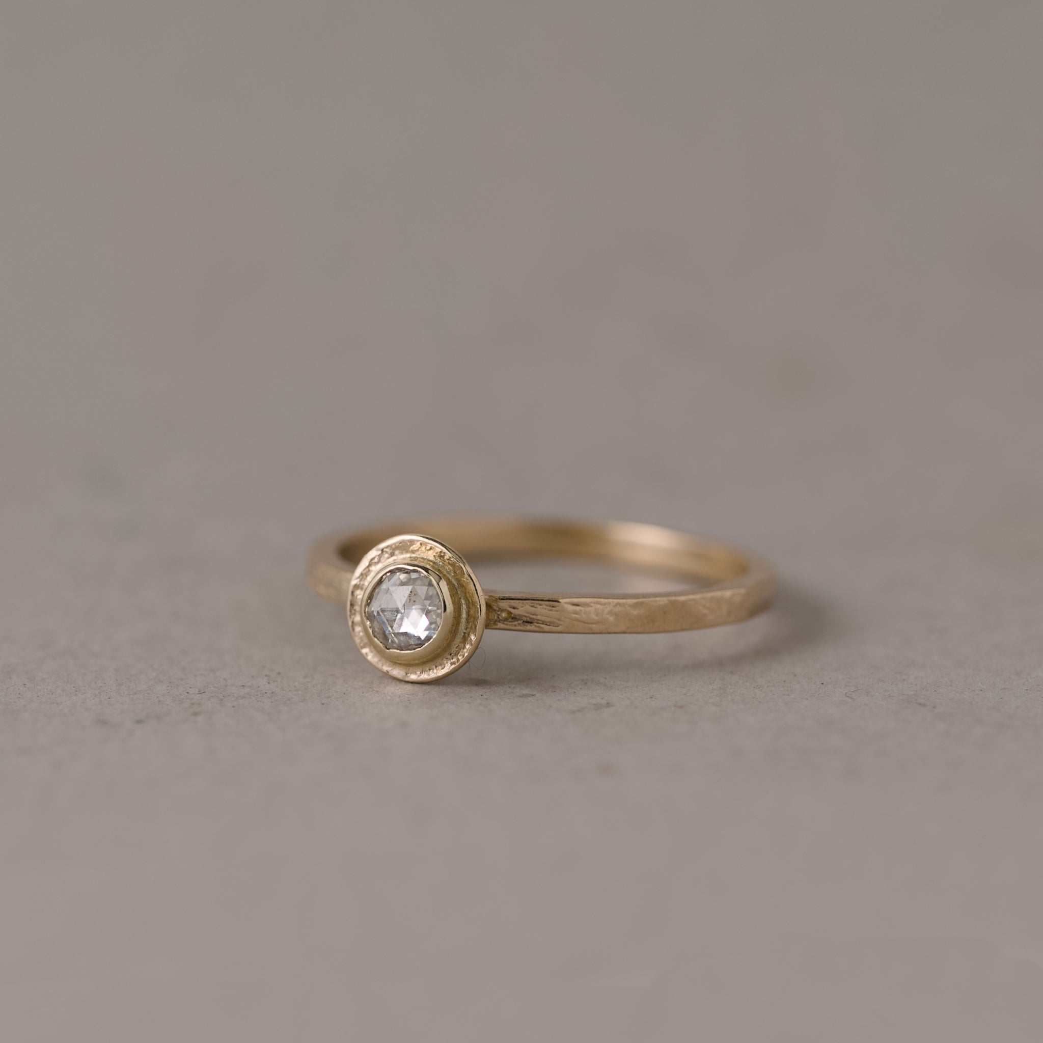 Soletta rose cut diamond ring in textured gold with soft radiant glow