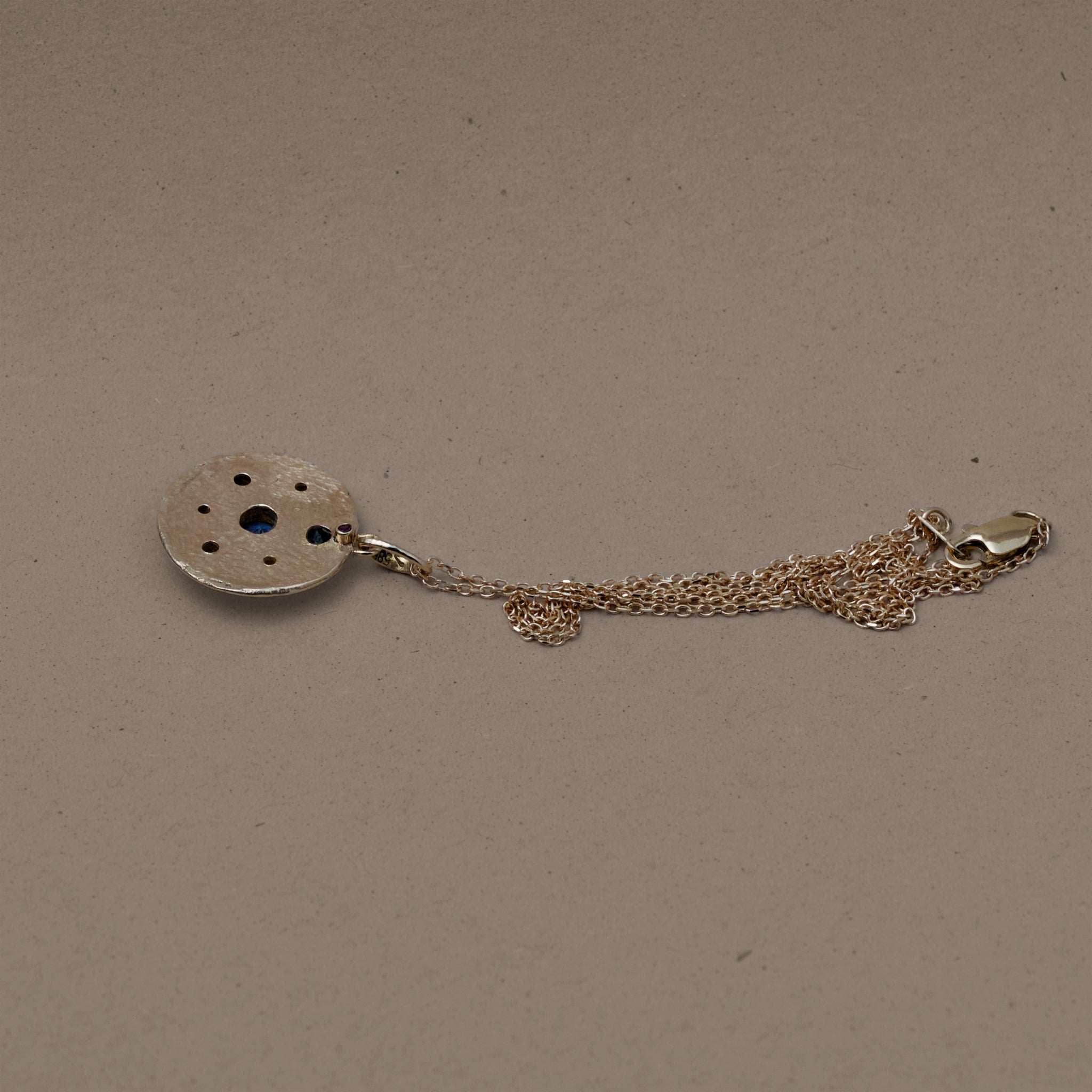Florin sapphire diamond necklace with Ceylon blue sapphire and natural diamonds on a textured solid gold pendant