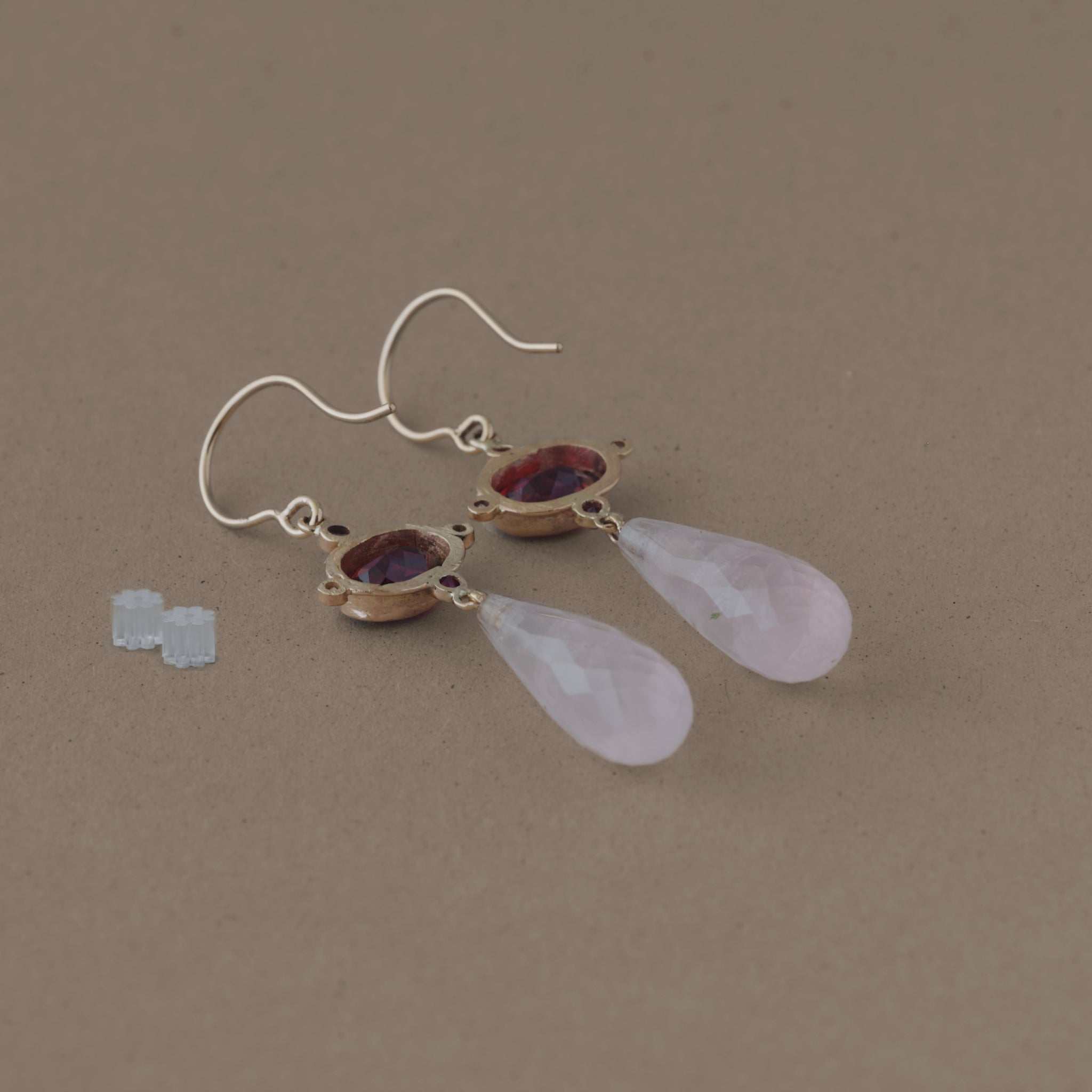 Elegant Sera Garnet Earrings with garnet, rose quartz, rubies, and diamonds set in gold.