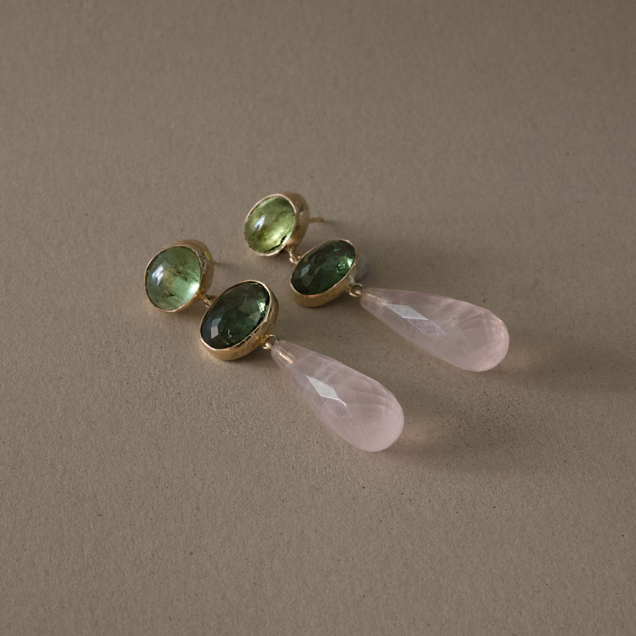 green tourmaline rose quartz earrings in gold with green tourmaline and rose quartz drops.