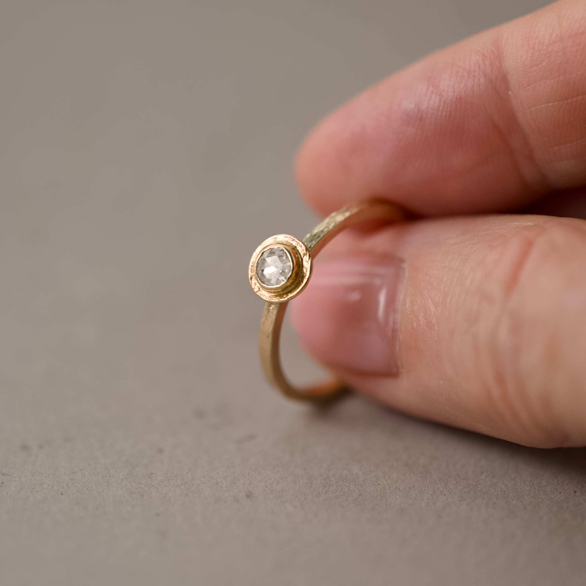 Soletta rose cut diamond ring in textured gold with soft radiant glow