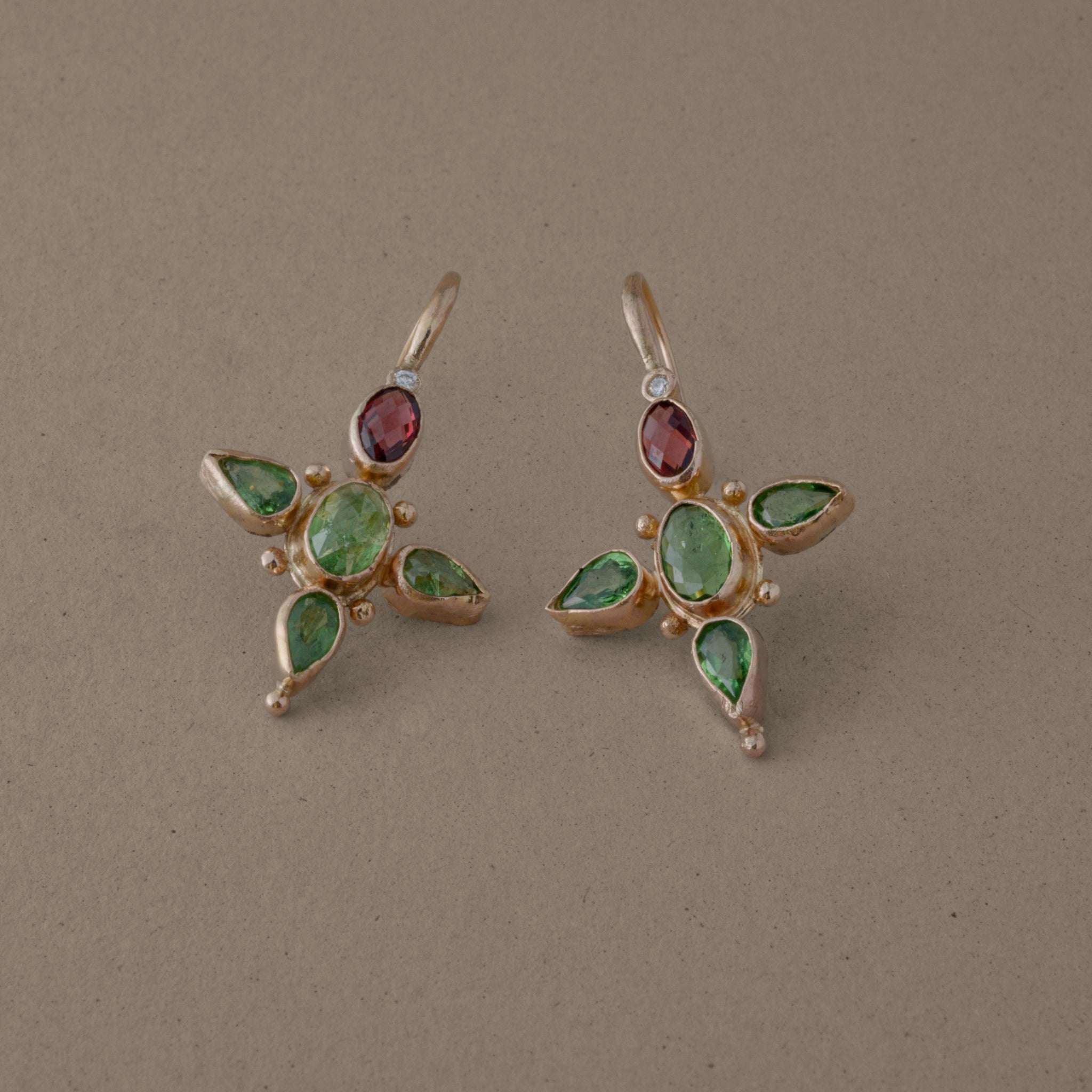 Stella Tsavorite Diamond Earrings with green tsavorite, magenta rhodolite garnets, and diamond accents in recycled 14ct gold.