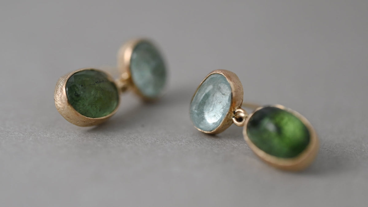 October’s birthstone, tourmaline, spans vivid greens, Paraíba blues, soft pinks and golden hues — interpreted in fine gold jewellery by Vermilion Jewellery.
