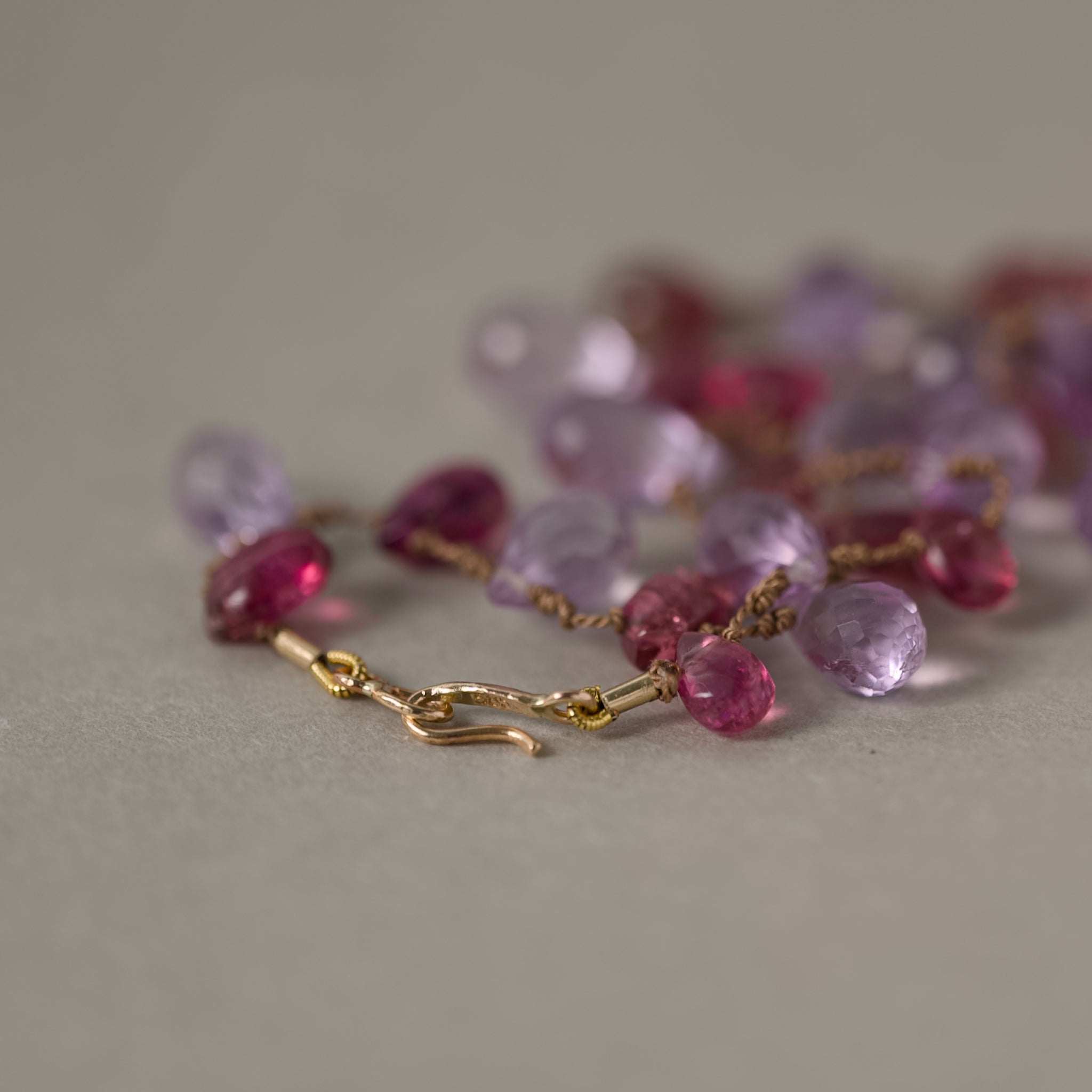 Close up of 14ct gold clasp amethyst and tourmaline silk necklace