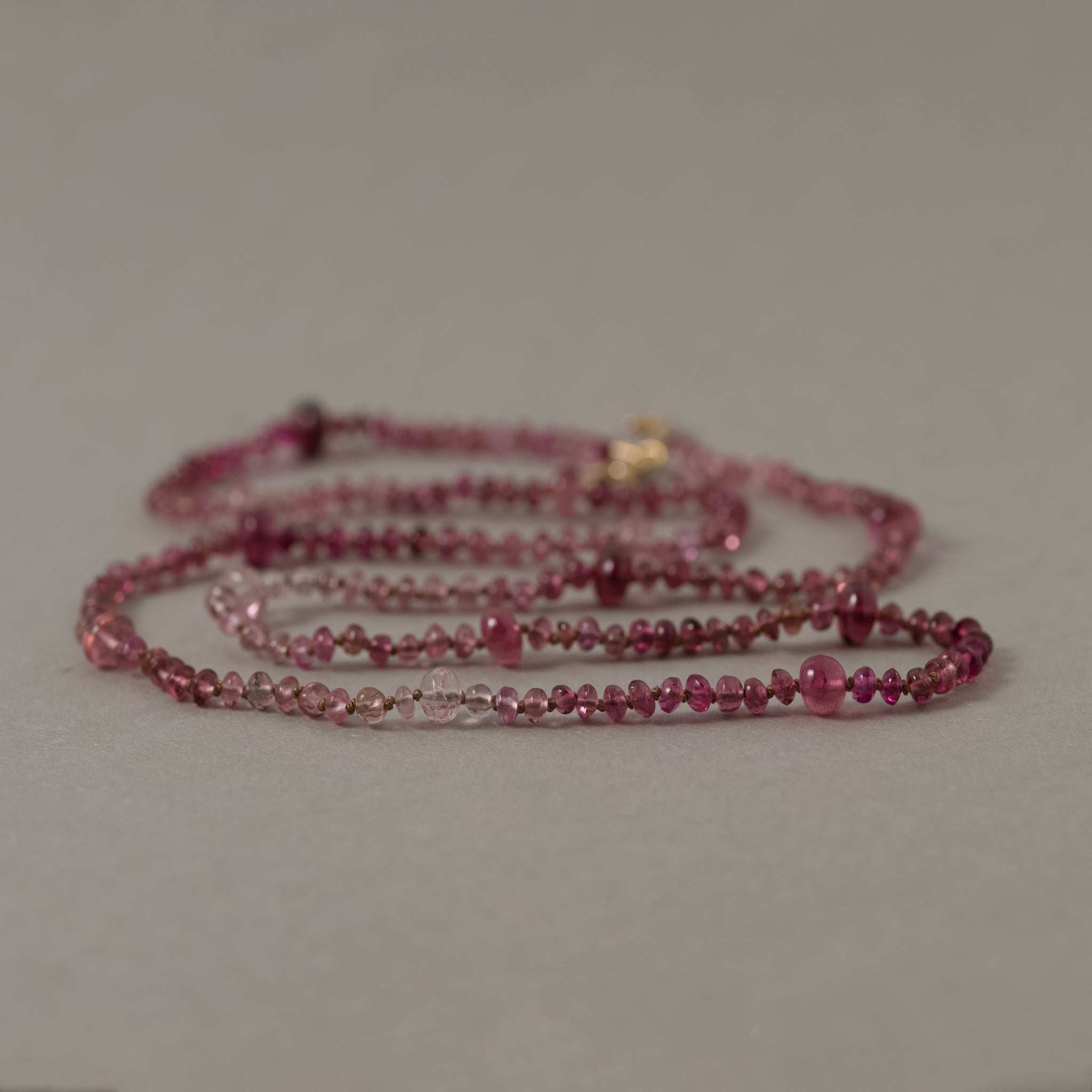 Filo Pink tourmaline necklace with gold on silk showcasing delicate rose shades