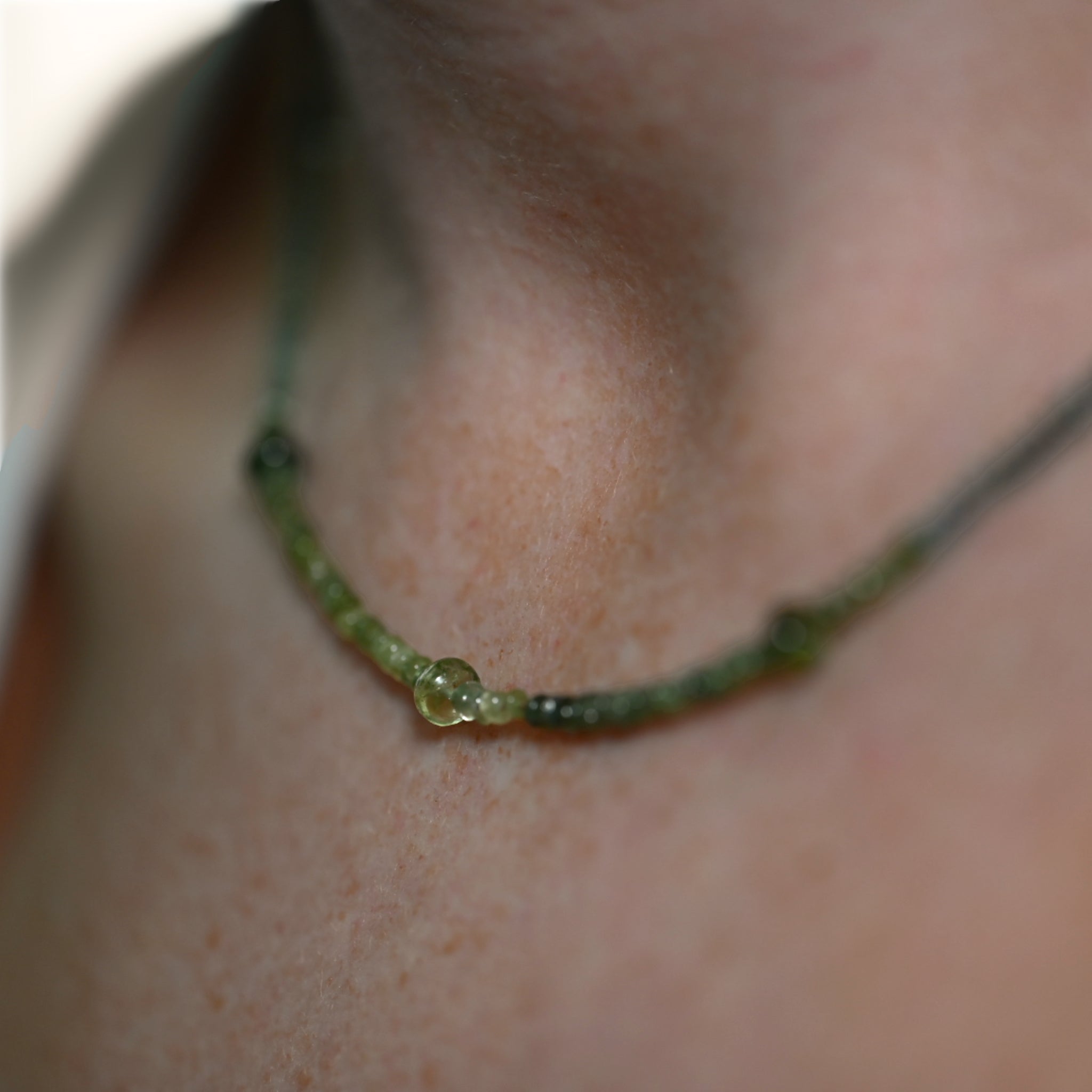 Filo green tourmaline necklace on silk with blue-green tourmalines worn on the neck in 14ct gold by Vermilion Jewellery Brisbane
