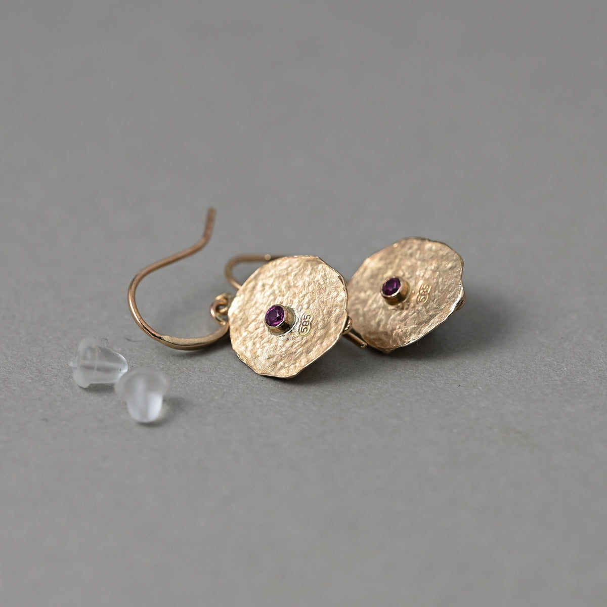 Back of Florin pink tourmaline earrings in solid 24ct gold showing vermilion ruby gemstones