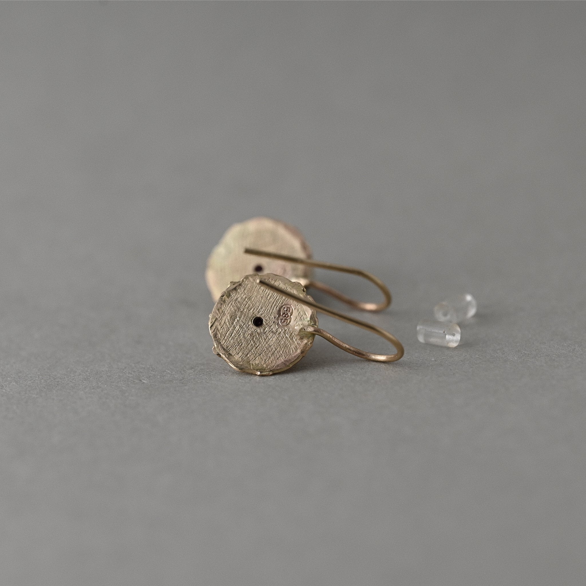 Florin 14ct solid gold discearrings showing backs with signature ruby. 