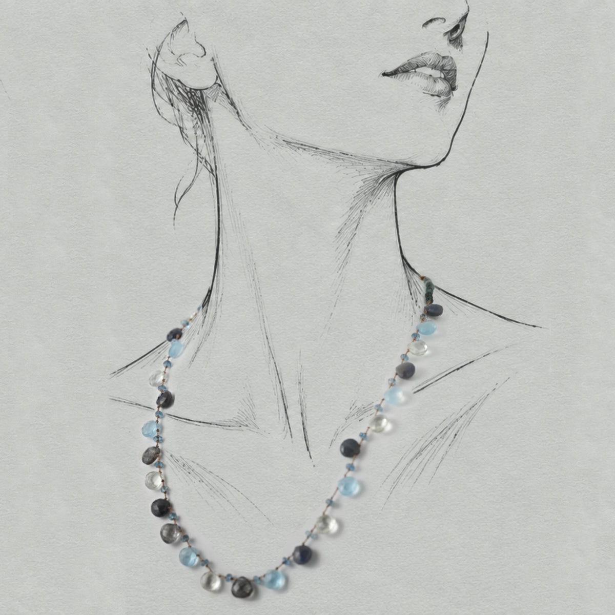 Lido sapphire, aquamarine and tourmaline necklace worn on a graphite illustrated figure.