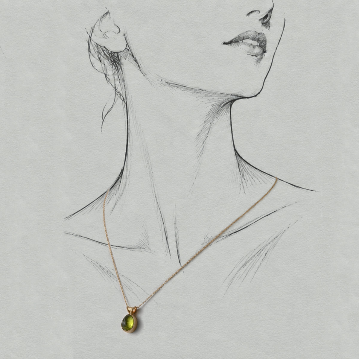 Uno Peridot gemstone on a 14ct gold necklace and setting  worn on a graphite illustrated figure.