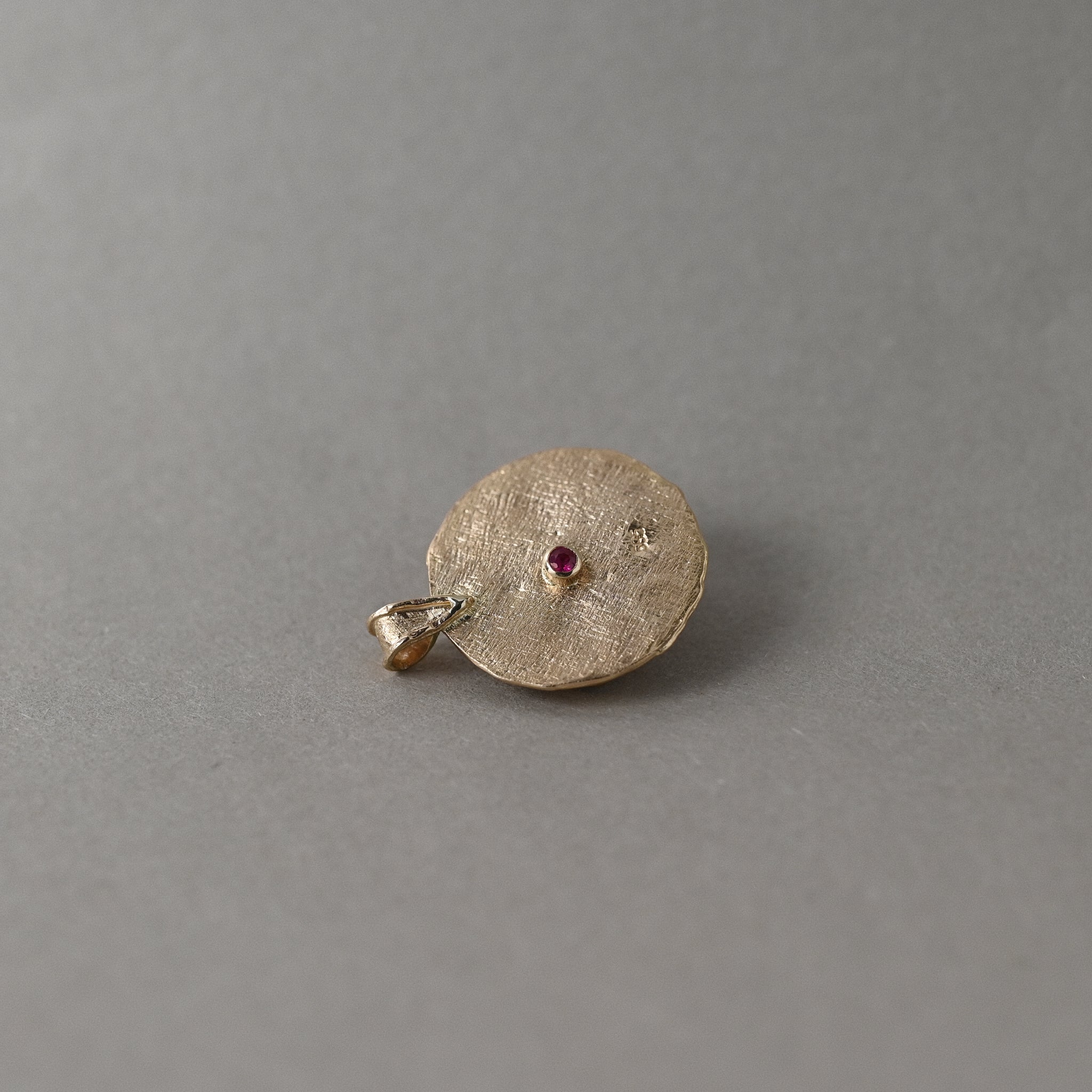 Back of Florin Moonstone 14ct gold with ruby gemstone detail. 