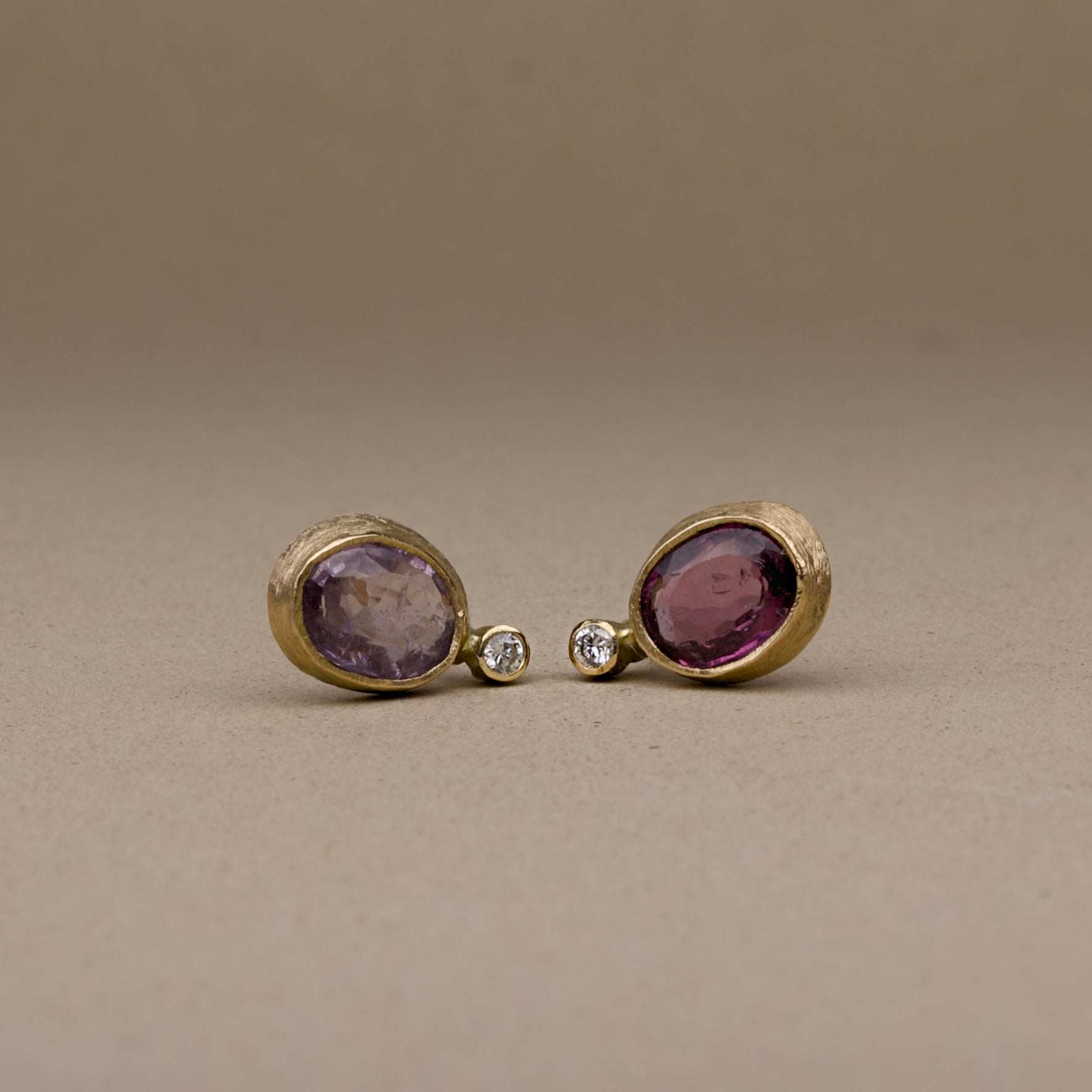 handmade Spinel Diamond Earrings in gold with gray and plum spinel gemstones and white diamonds.