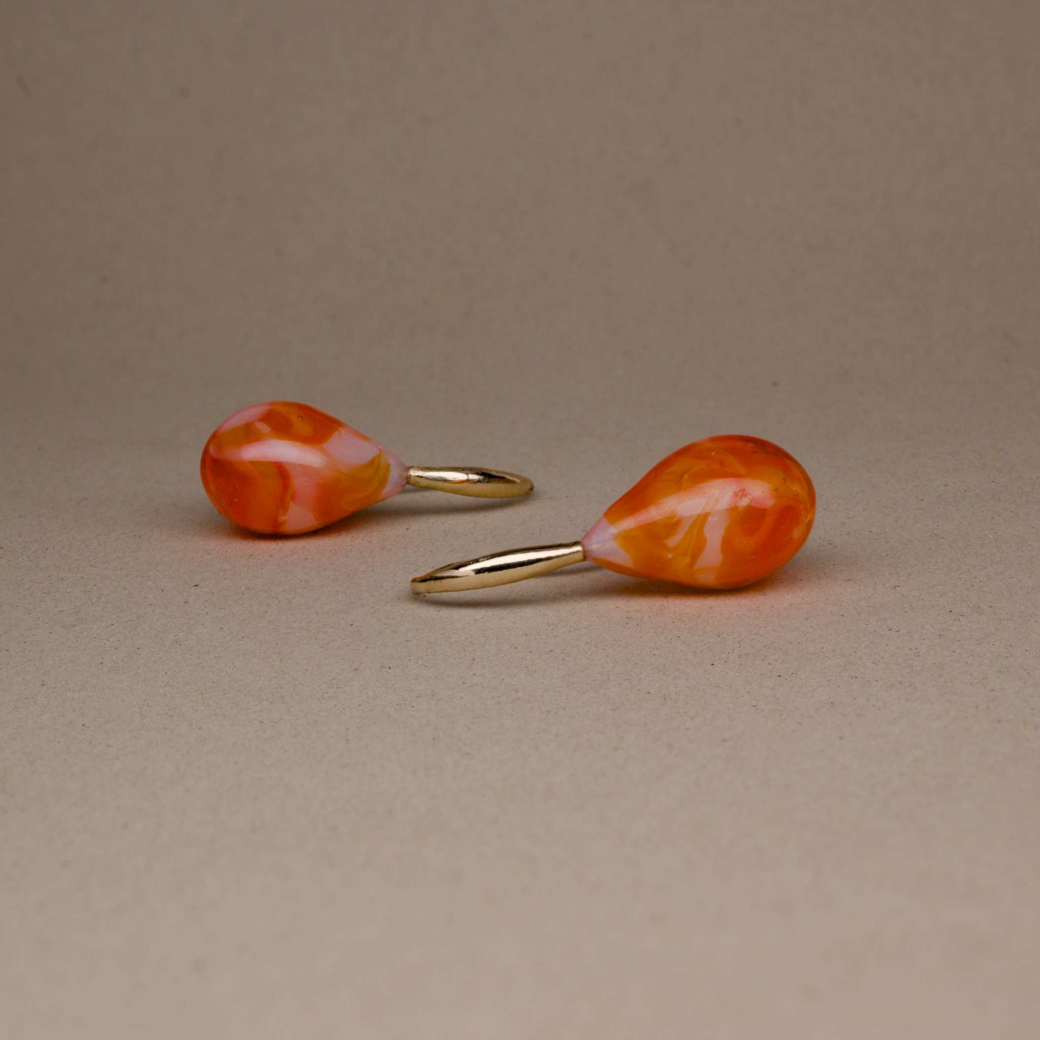 Bella Mandarin Murano Gold Drop Earrings with gold settings, hand-crafted glass in vibrant mandarin hue.