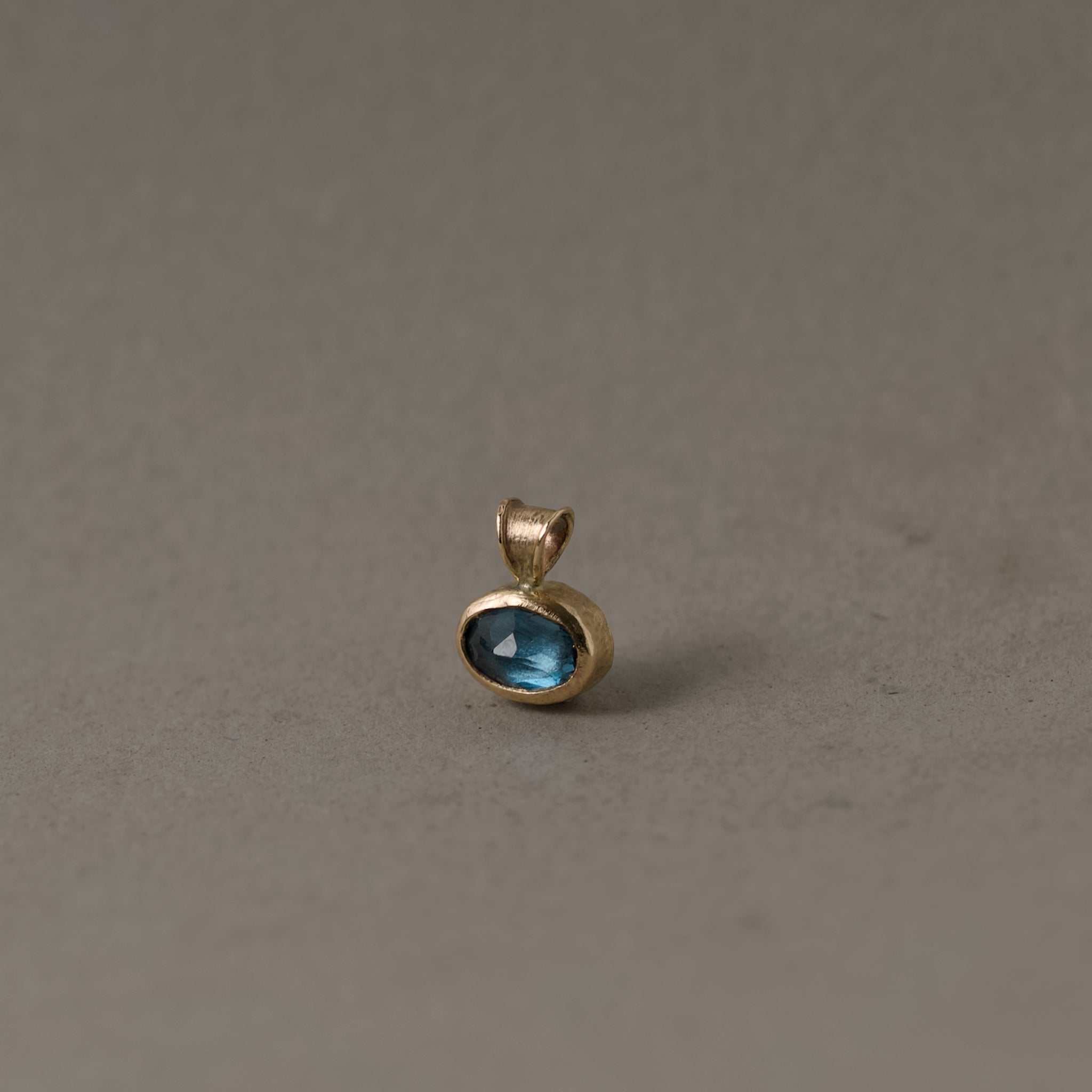 blue topaz gold pendant
