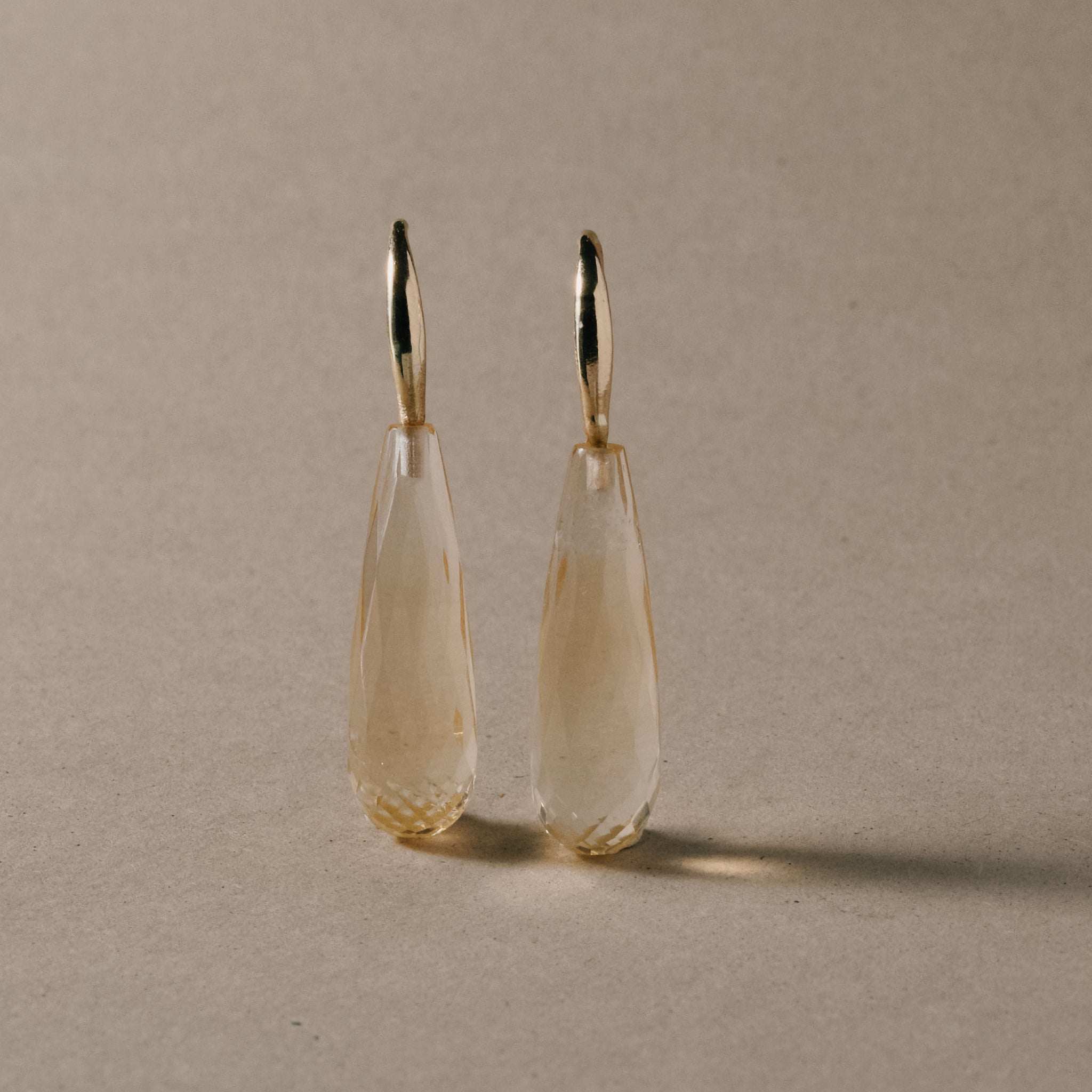 Citrine drop earrings with pale golden facetted teardrops and 14ct gold hooks.