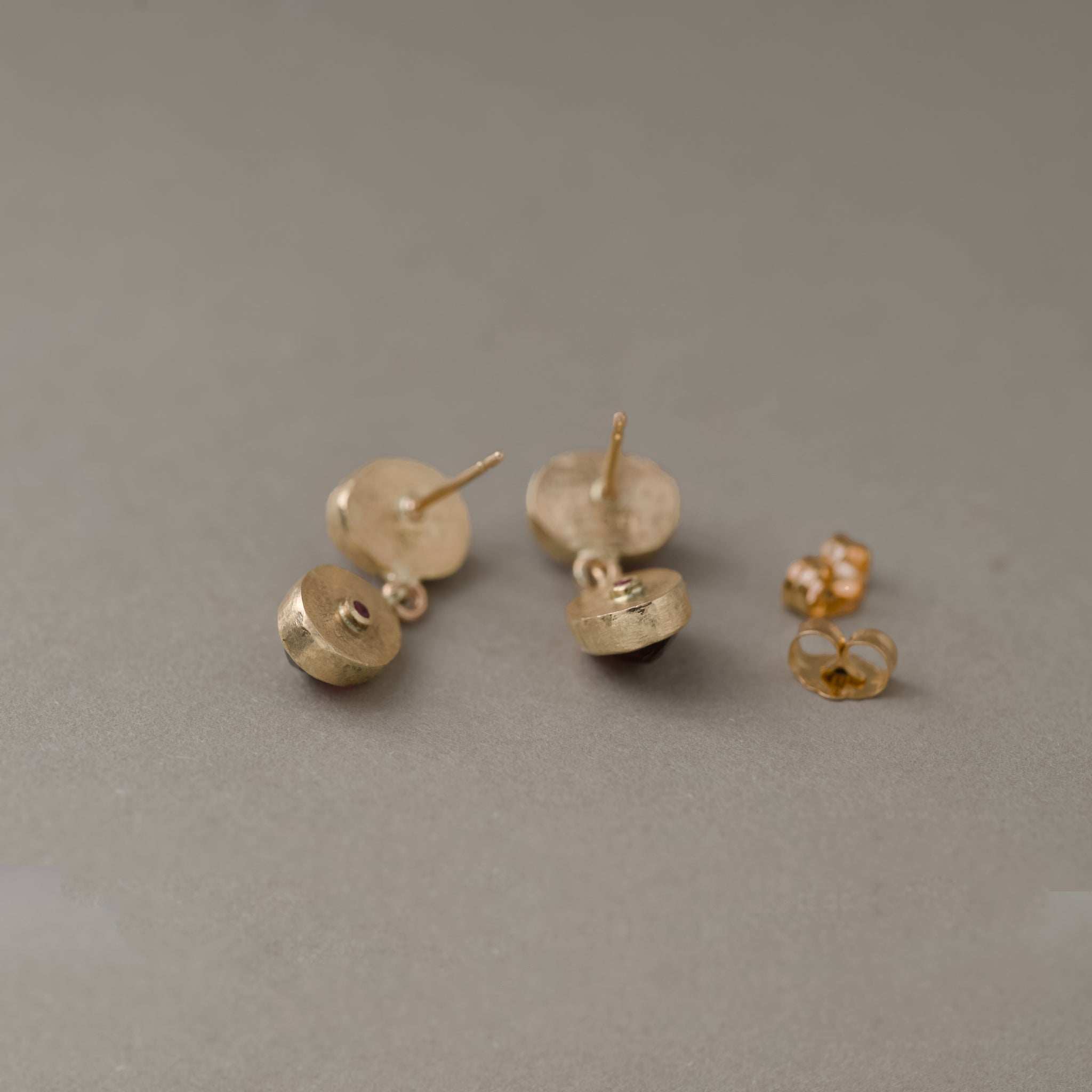 Duo Rhodolite Garnet stud earrings with sparkling stones in gold setting