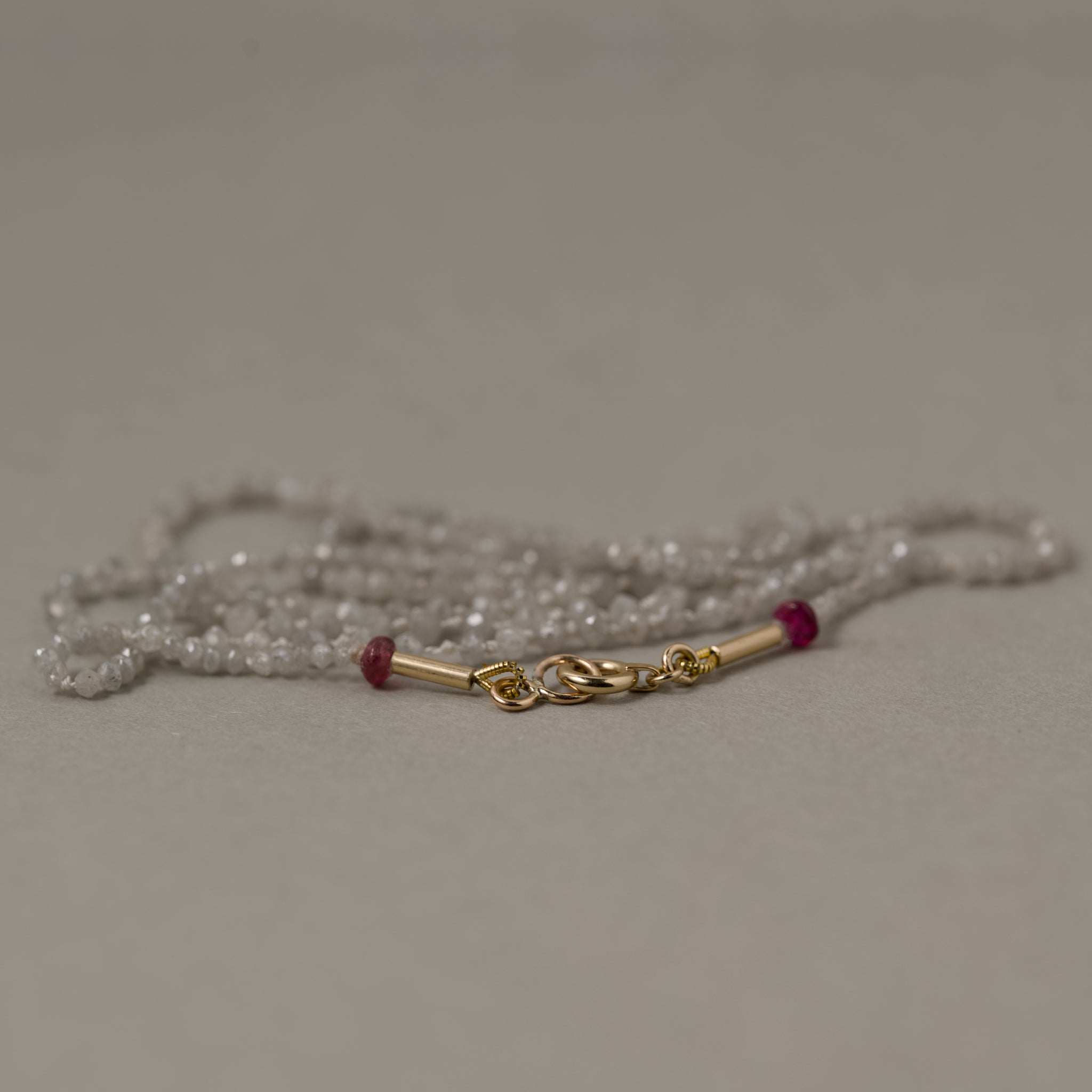 iamond bead strand necklace with ruby signature clasp gold detail