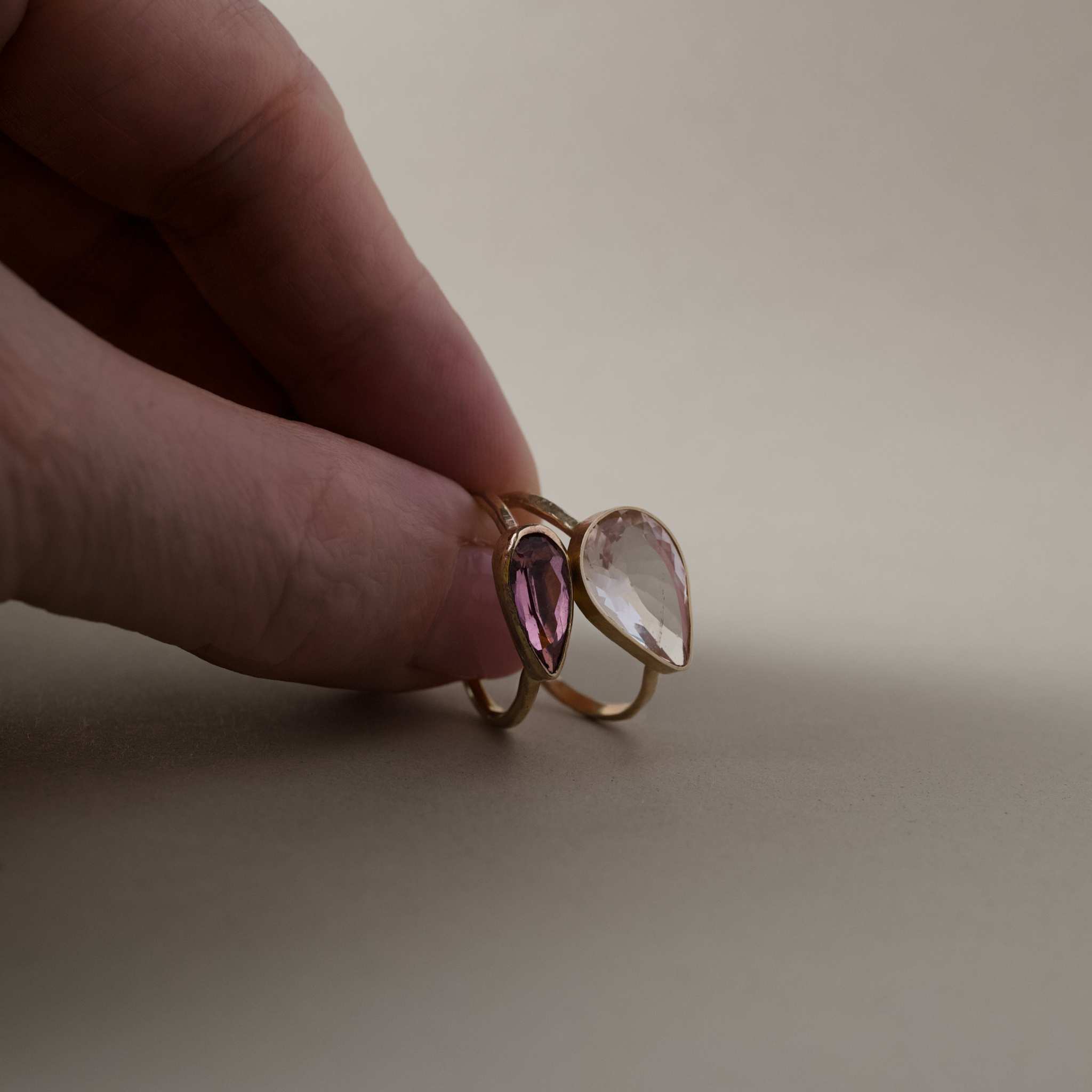 morganite ring with rose pear stone in hammered gold band.