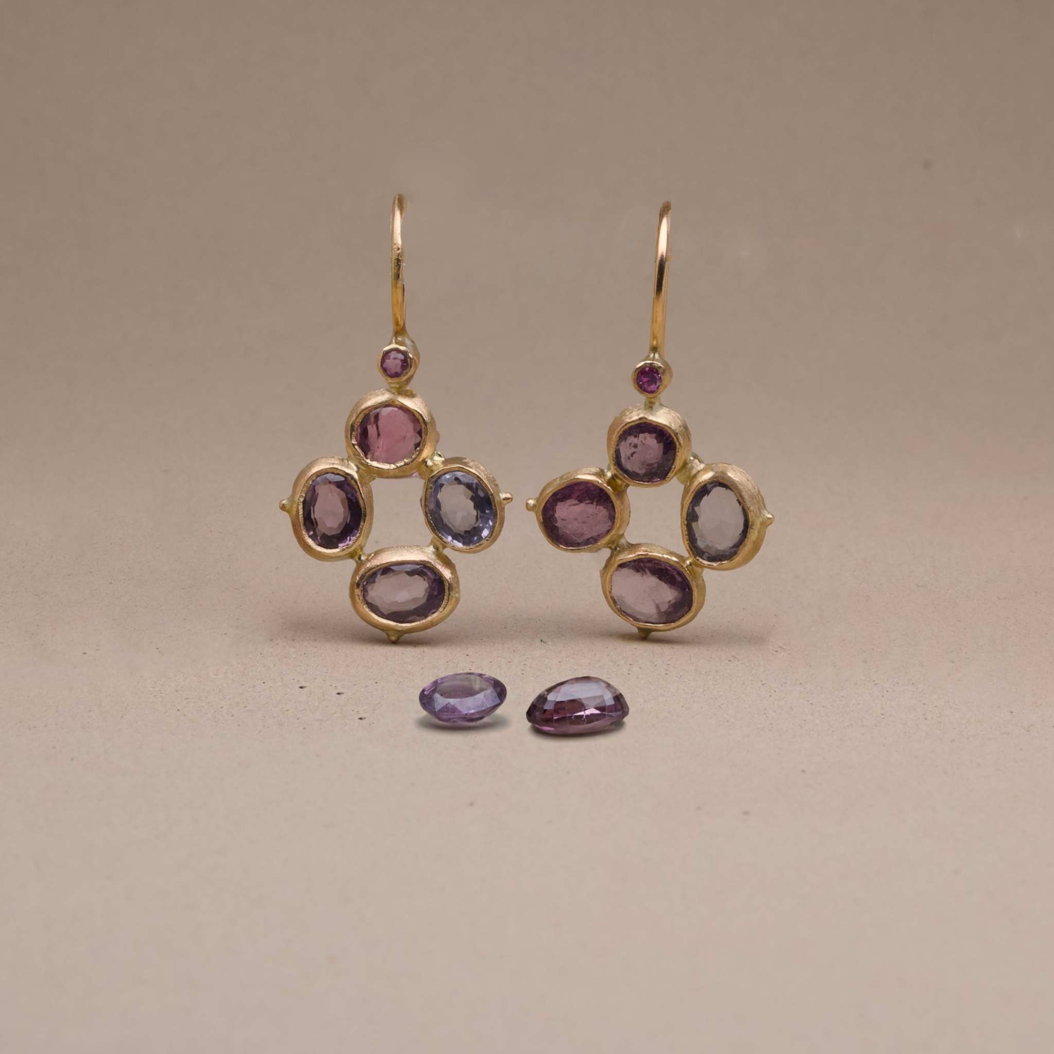 Flora Spinel Sapphire flower Earrings featuring plum and grey spinel stones with magenta pink sapphires in gold setting.