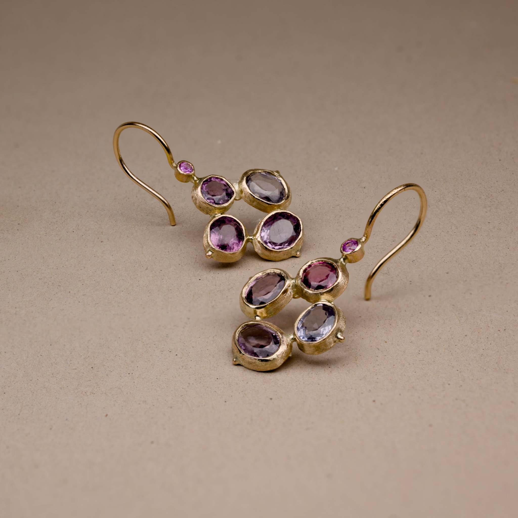 Flora Spinel Sapphire flower Earrings with pastel plum and grey stones in gold, adorned with magenta pink sapphires.