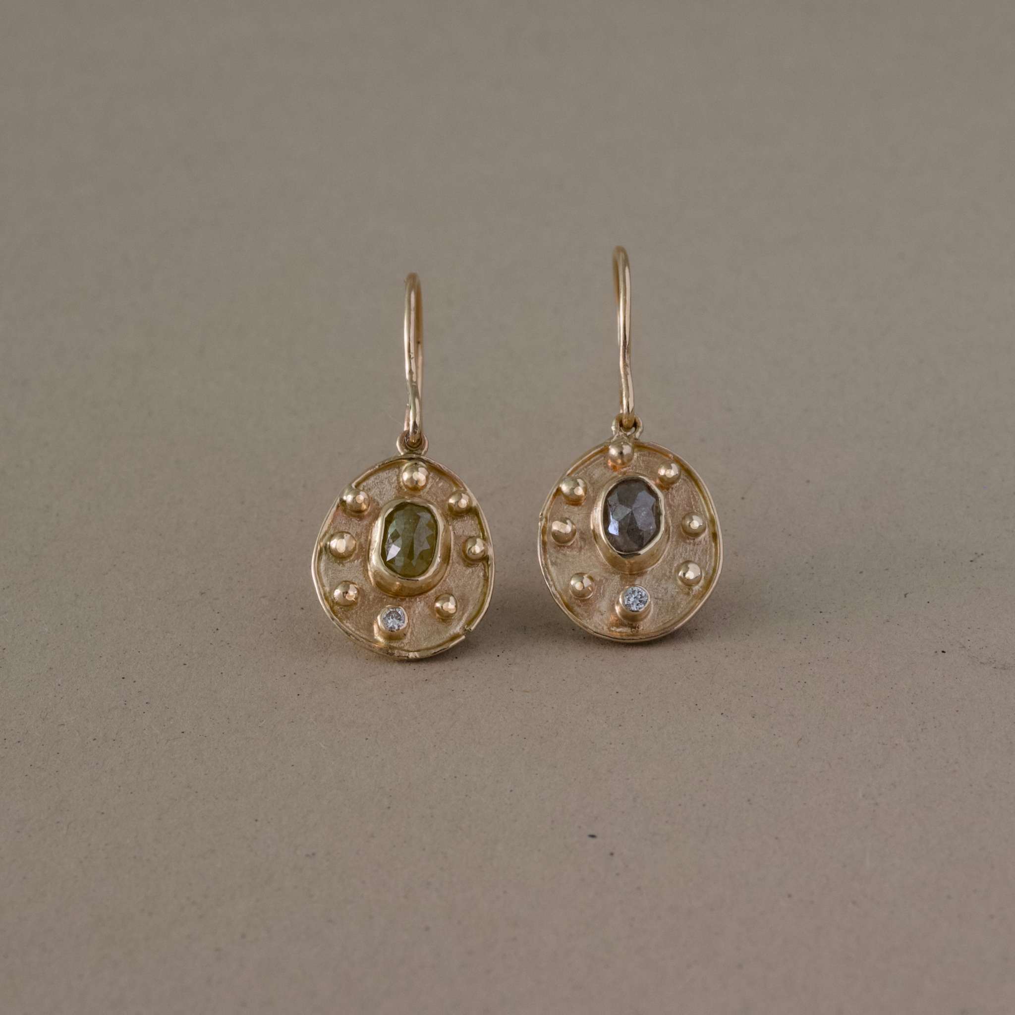 handcrafted raw diamond earringss with gold setting and natural toned diamonds.